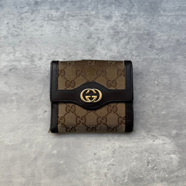 Gucci GG Monogram Small Wallet in beige canvas with dark brown leather trim and gold-tone GG logo, featuring card slots and coin pocket.