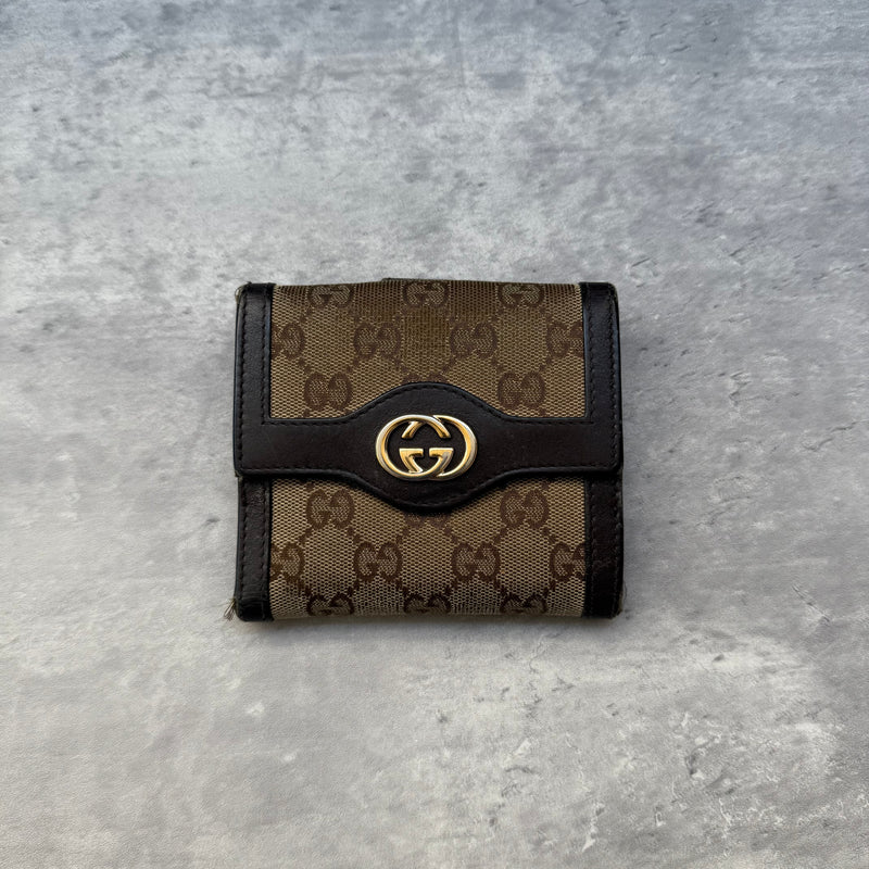 Gucci GG Monogram Small Wallet in beige canvas with dark brown leather trim and gold-tone GG logo, featuring card slots and coin pocket.