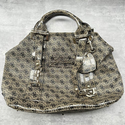 Guess Faux Fur Crossbody Bag, featuring monogram logo print in taupe faux leather with silver-tone hardware, patent trim, and heart-print interior lining.