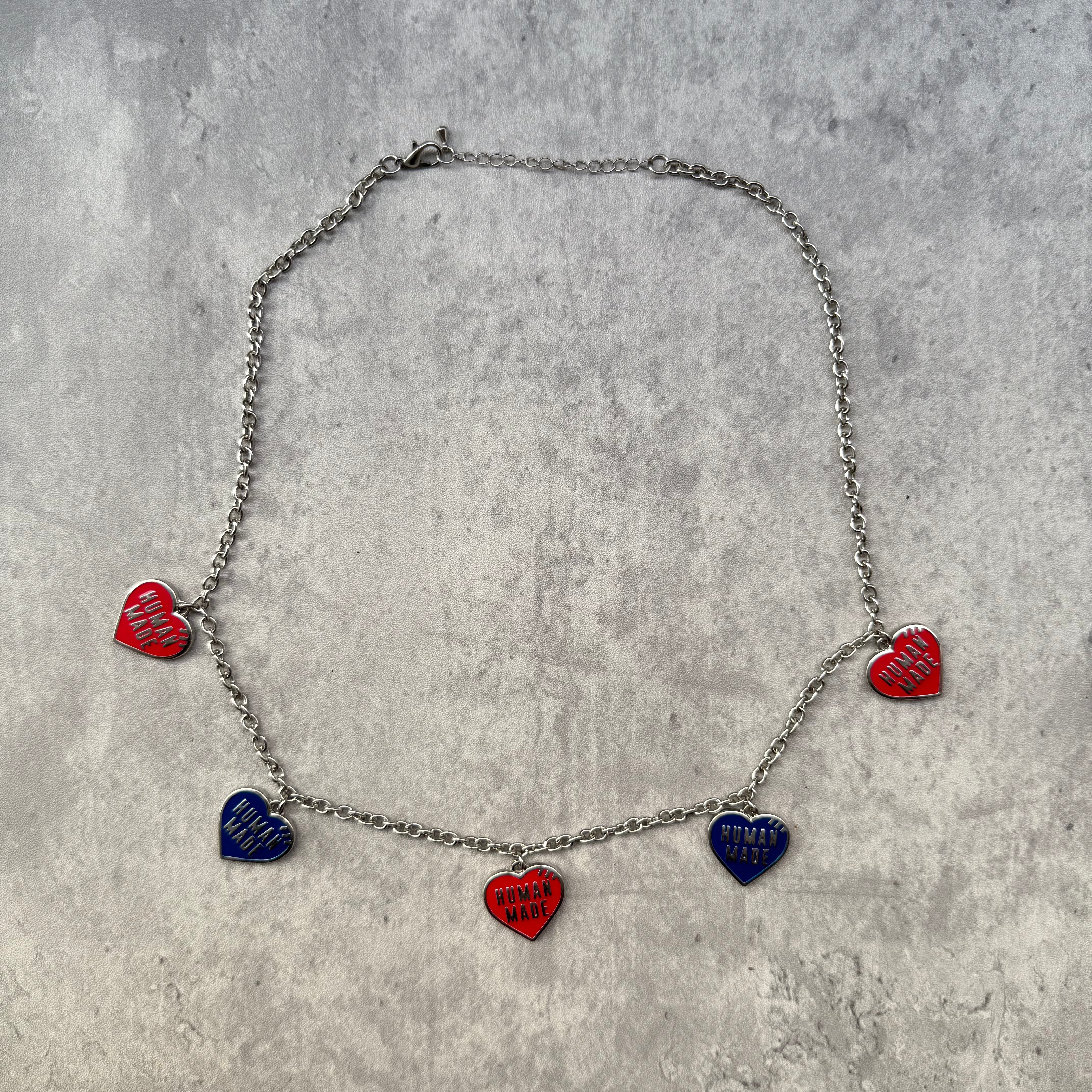 Human Made 5 Hearts Necklace with silver-tone chain, featuring alternating red and blue enamel heart charms