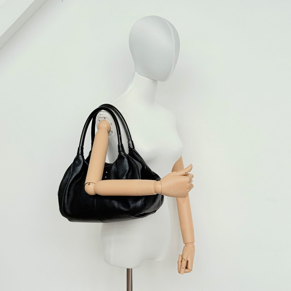 Kate Spade New York Stevie Berkshire Road Shoulder Bag in black pebbled leather with gold-tone hardware and double top handles.