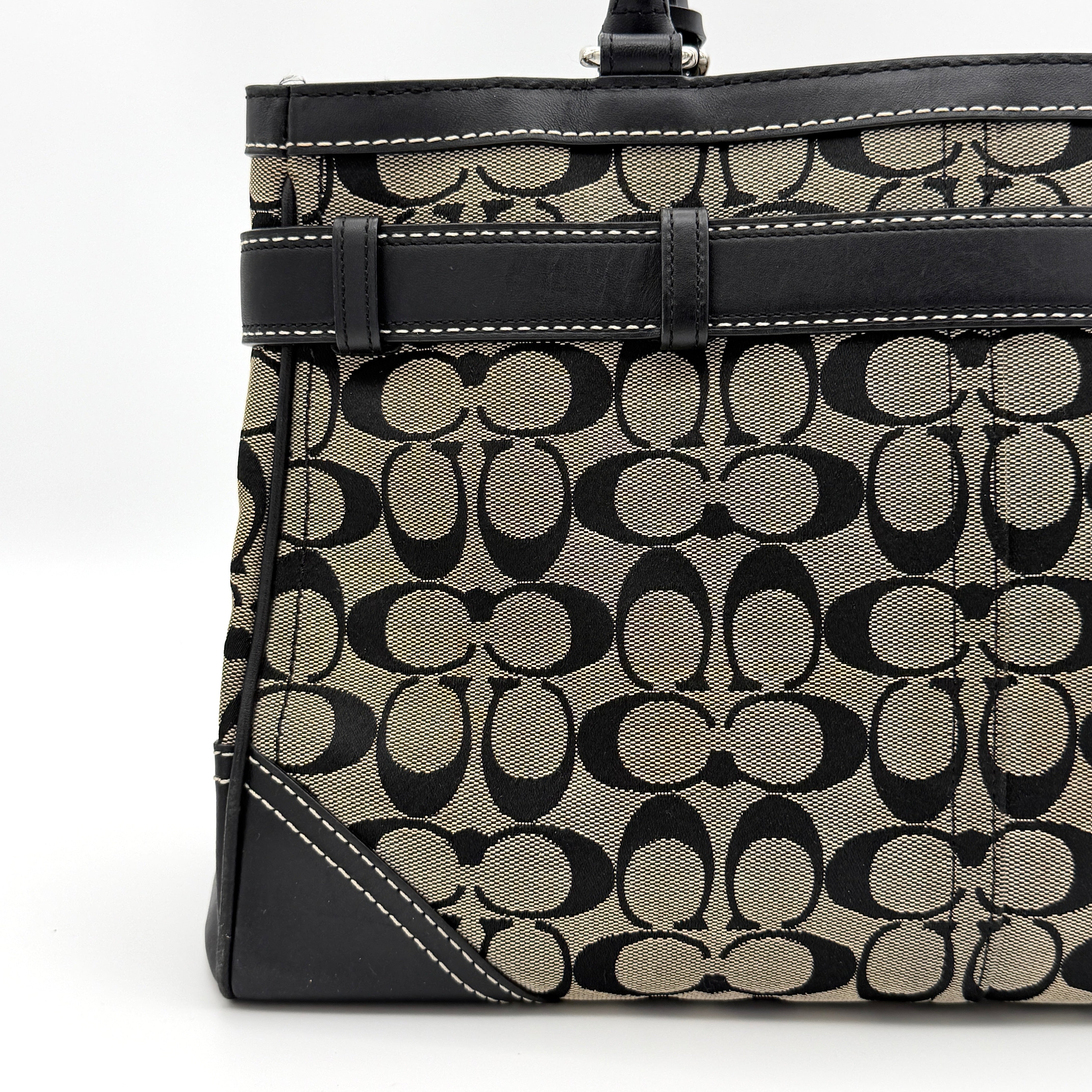 Coach Signature Hampton Clip Shoulder Bag in grey and black canvas with leather trim and silver-tone hardware, displayed with double handles.