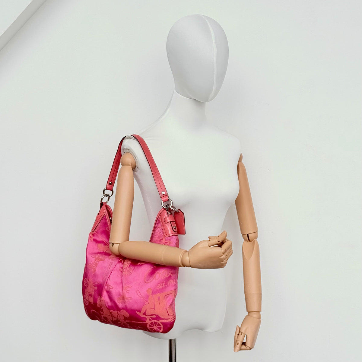 Coach pink and orange Horse & Carriage sateen hobo shoulder bag with detachable strap and leather trim.