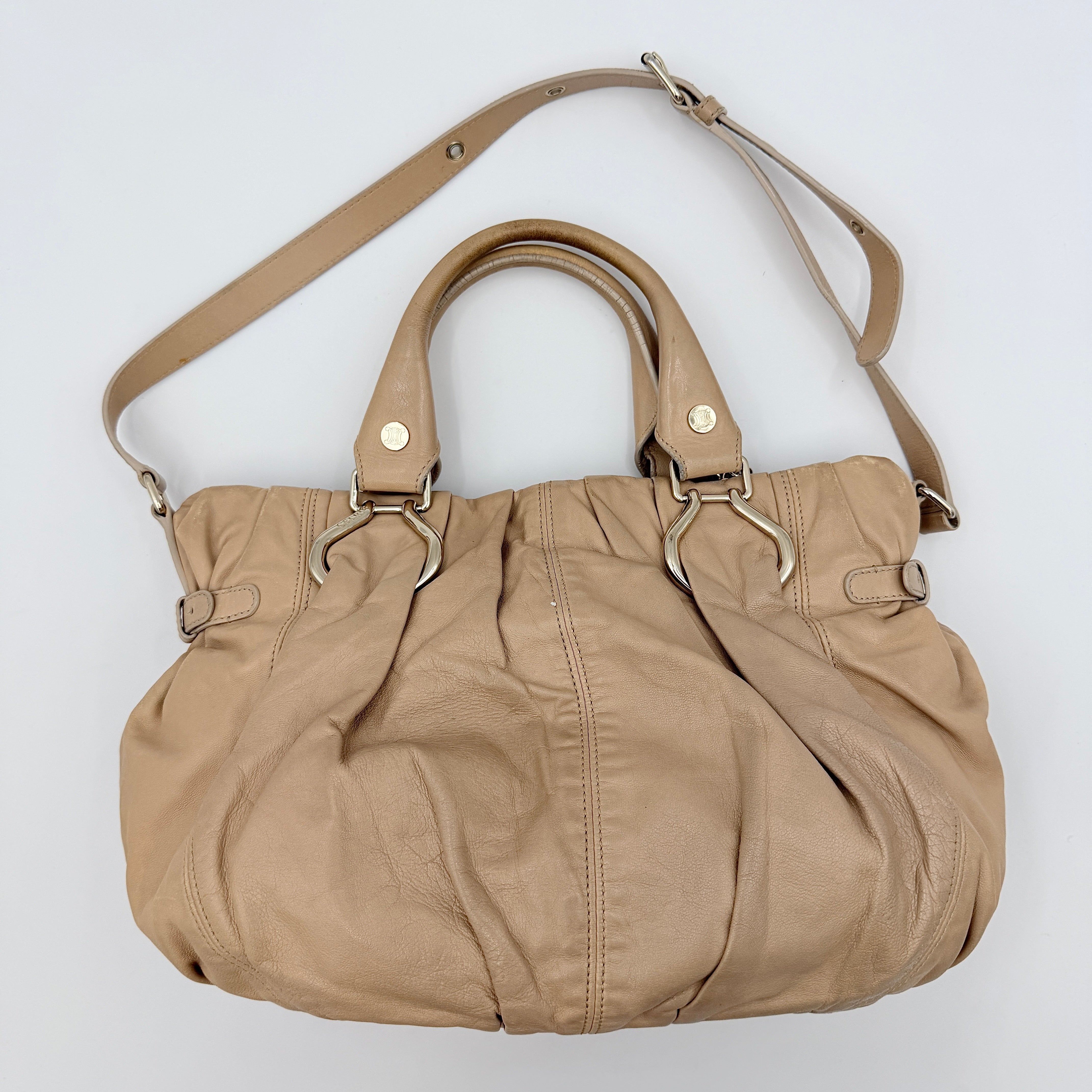 Celine 2Way Leather Shoulder Bag in muted brown leather with gold-tone hardware, adjustable strap, and double handles.