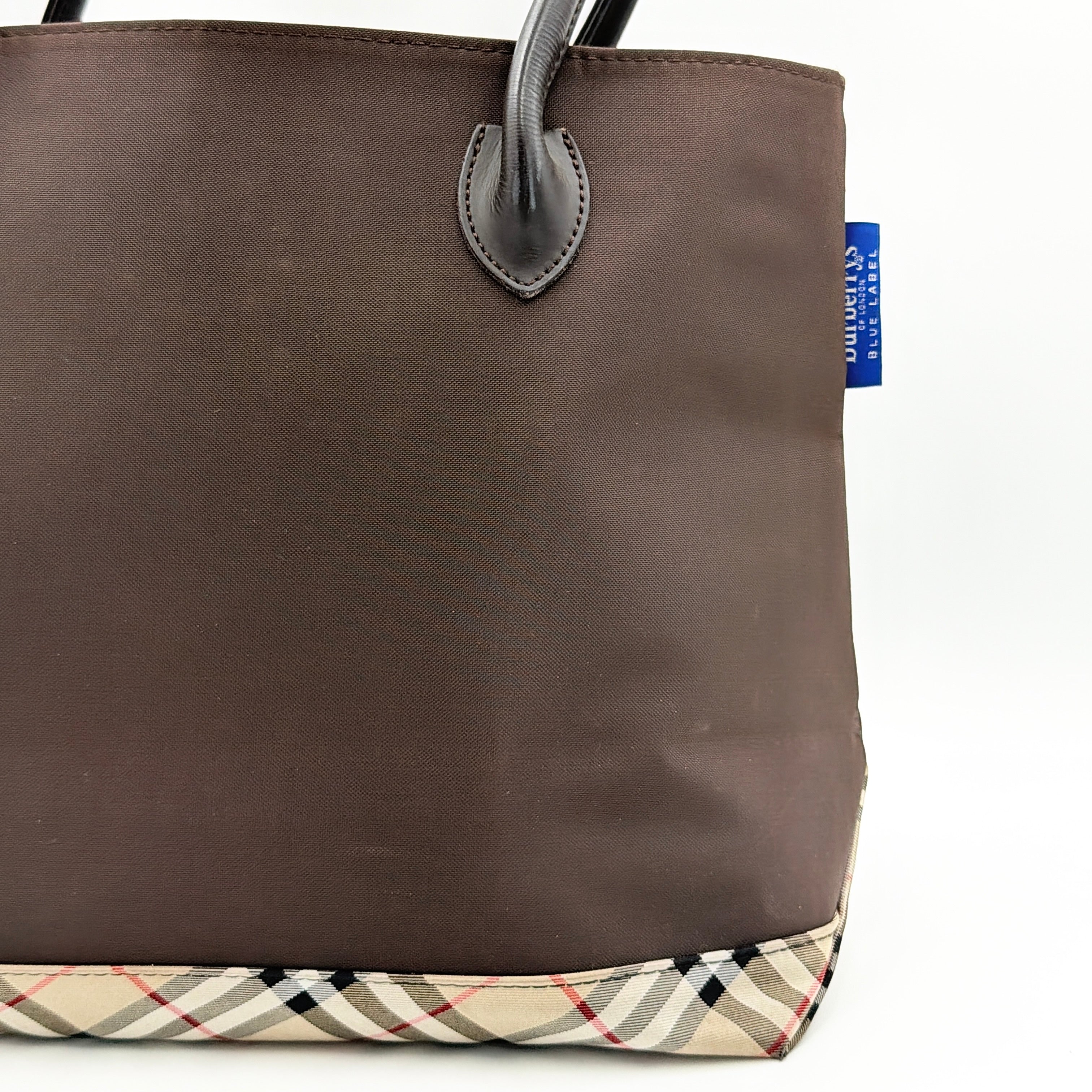 Burberry Blue Label nylon tote bag in brown with iconic check-detail base and structured double handles.