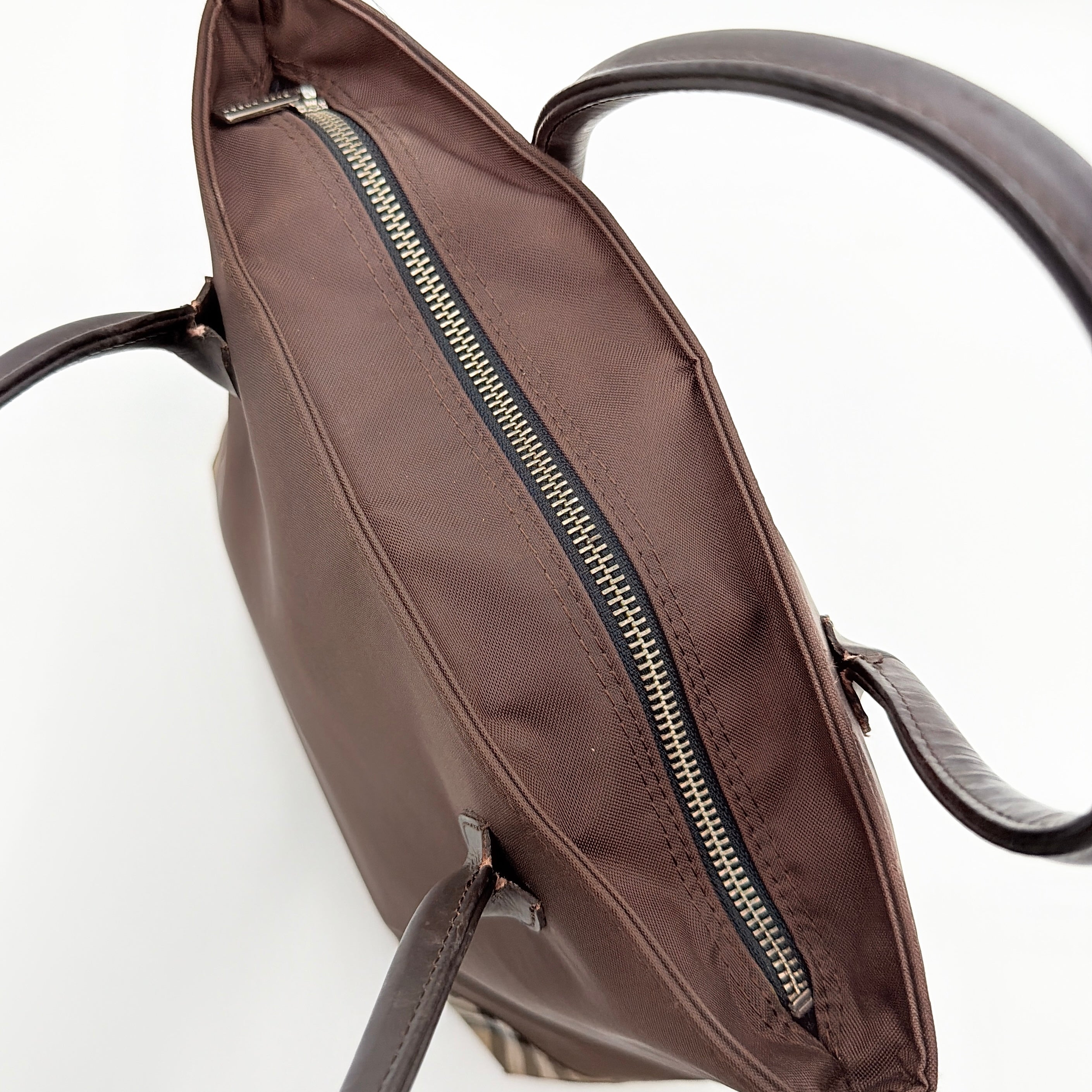 Burberry Blue Label nylon tote bag in brown with iconic check-detail base and structured double handles.