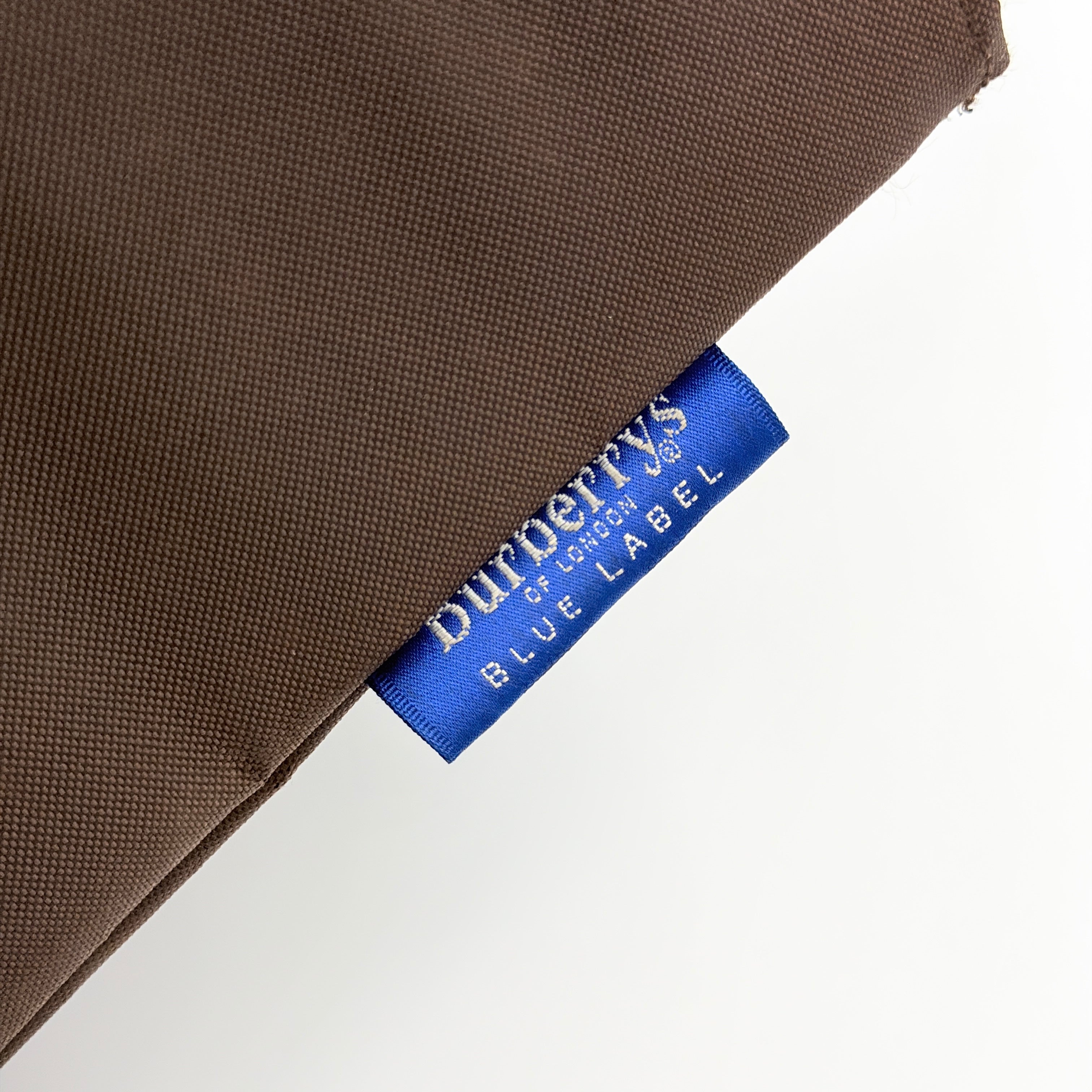 Burberry Blue Label nylon tote bag in brown with iconic check-detail base and structured double handles.