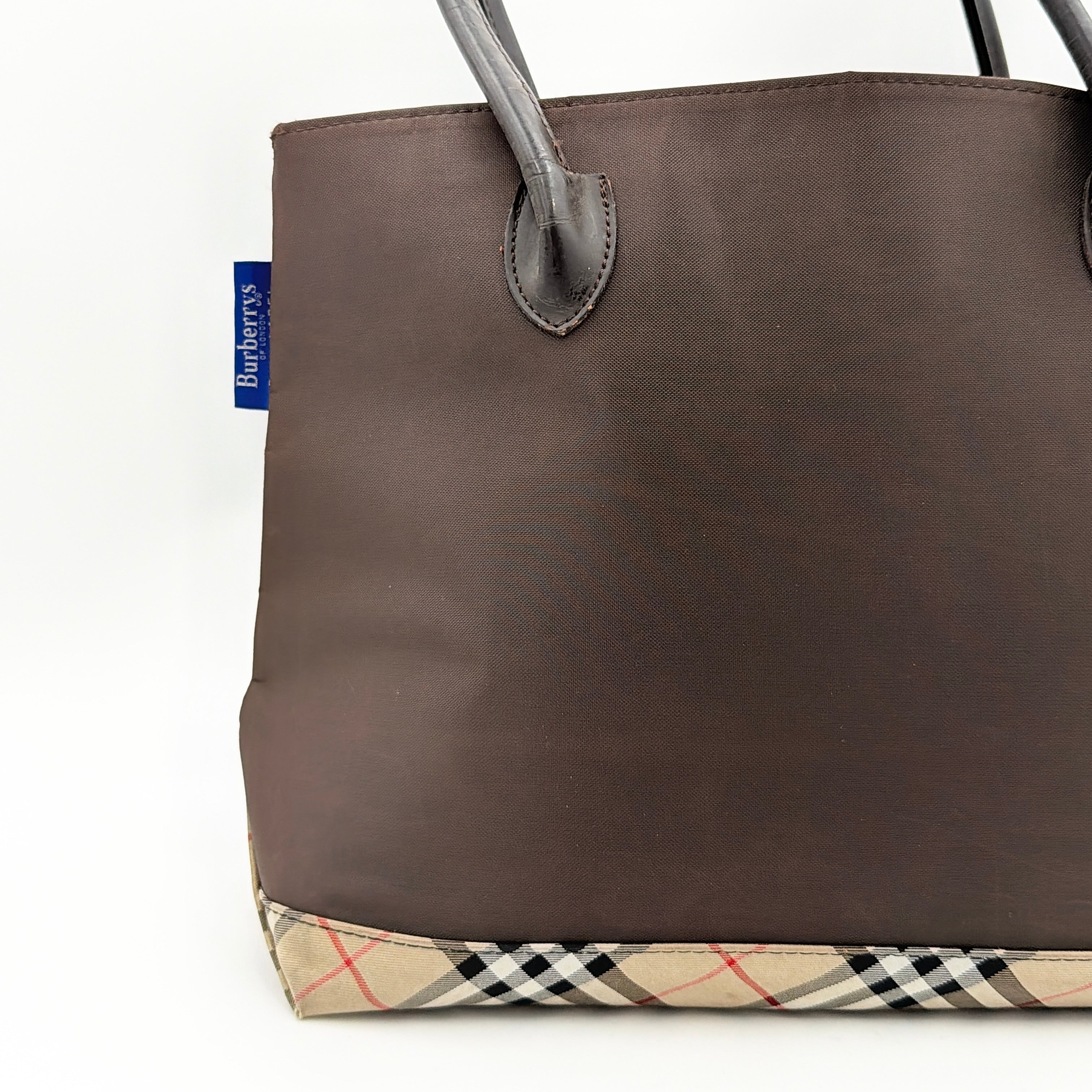 Burberry Blue Label nylon tote bag in brown with iconic check-detail base and structured double handles.