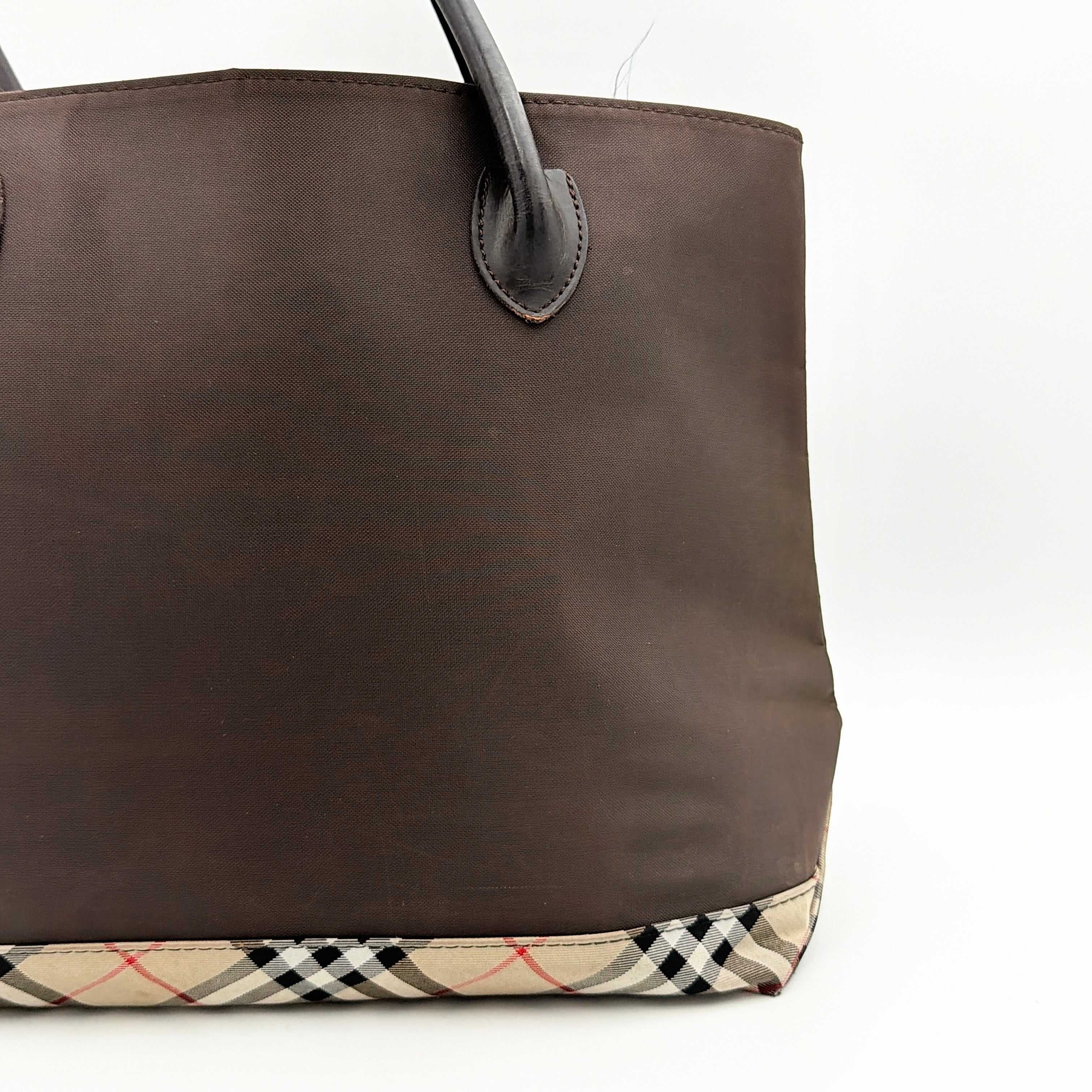 Burberry Blue Label nylon tote bag in brown with iconic check-detail base and structured double handles.