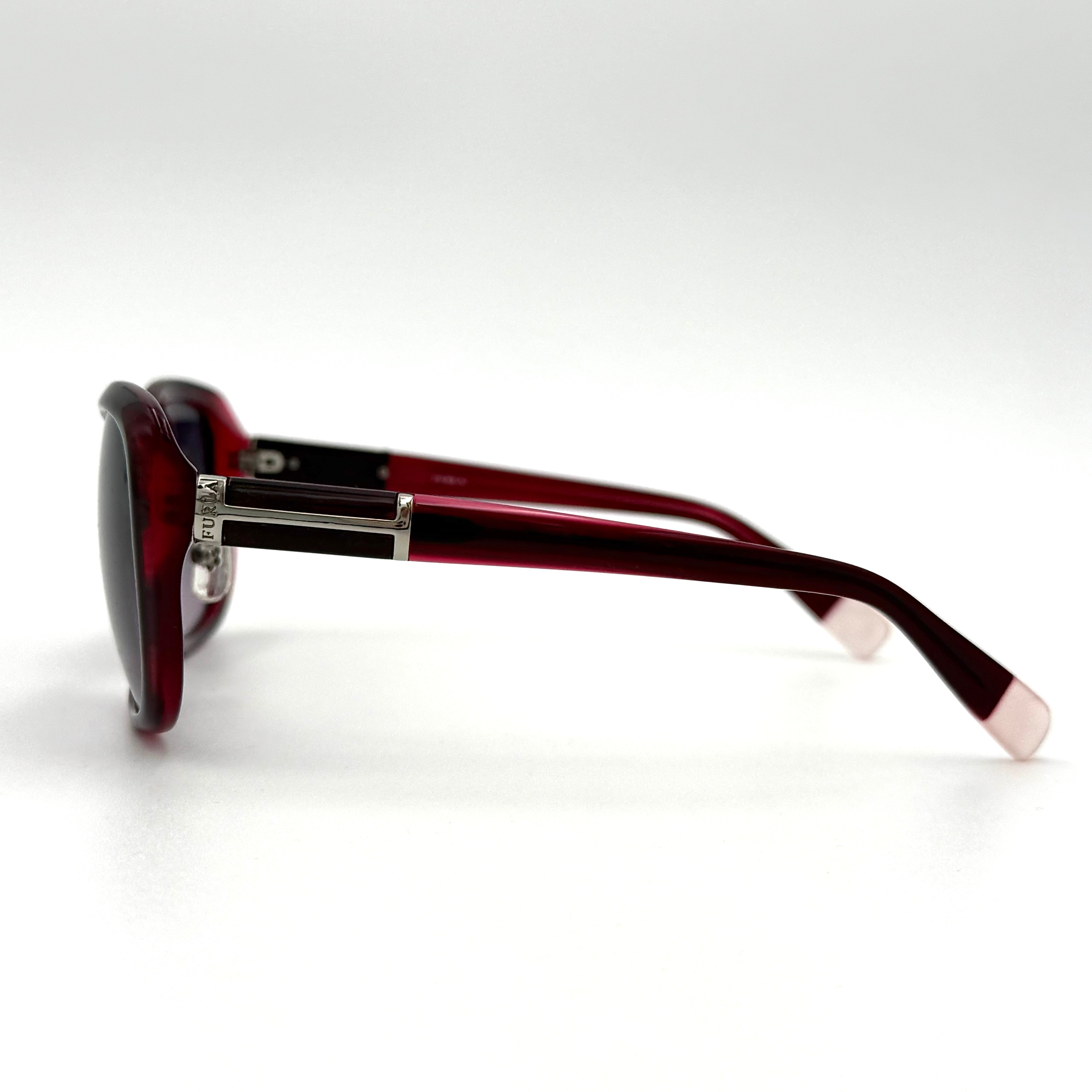 Furla SU4925J sunglasses in dark red acetate with butterfly-shaped frames, silver-tone hardware, and gradient lenses, presented alongside a Furla hard case.