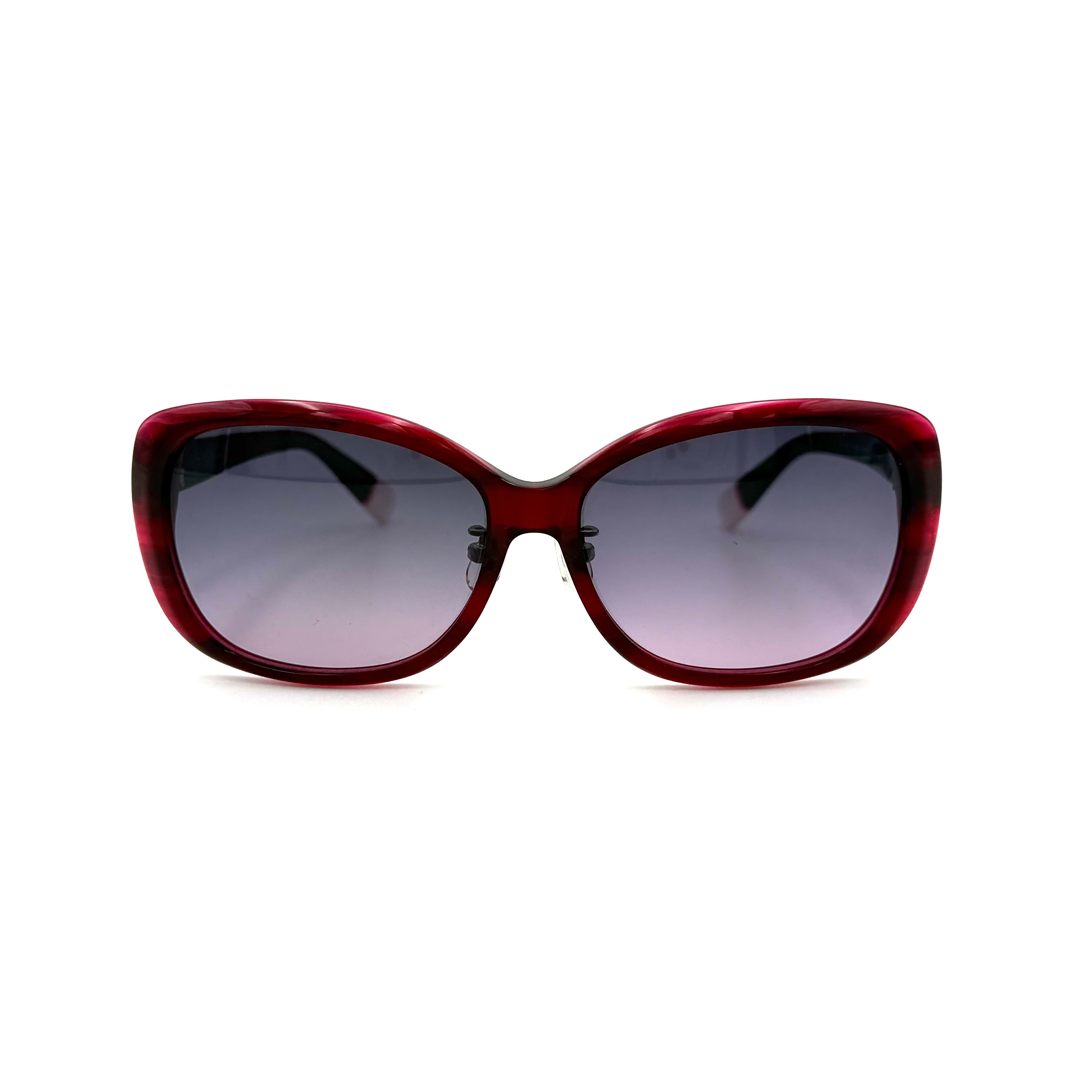 Furla SU4925J sunglasses in dark red acetate with butterfly-shaped frames, silver-tone hardware, and gradient lenses, presented alongside a Furla hard case.