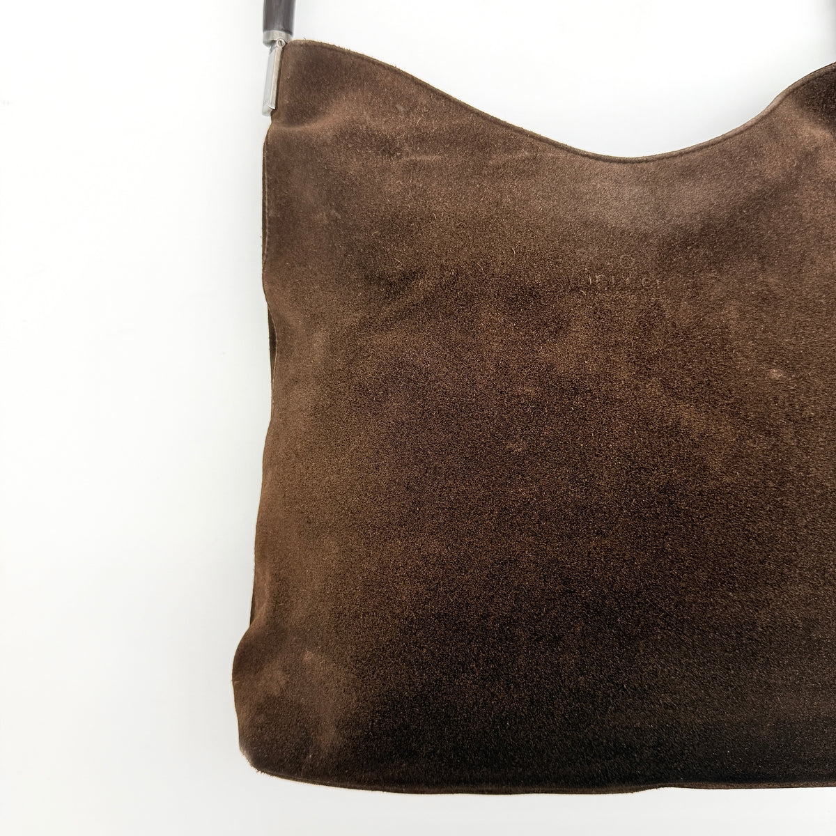 Gucci Bamboo Shoulder Bag in brown suede with a sculpted bamboo handle, photographed on a white background.