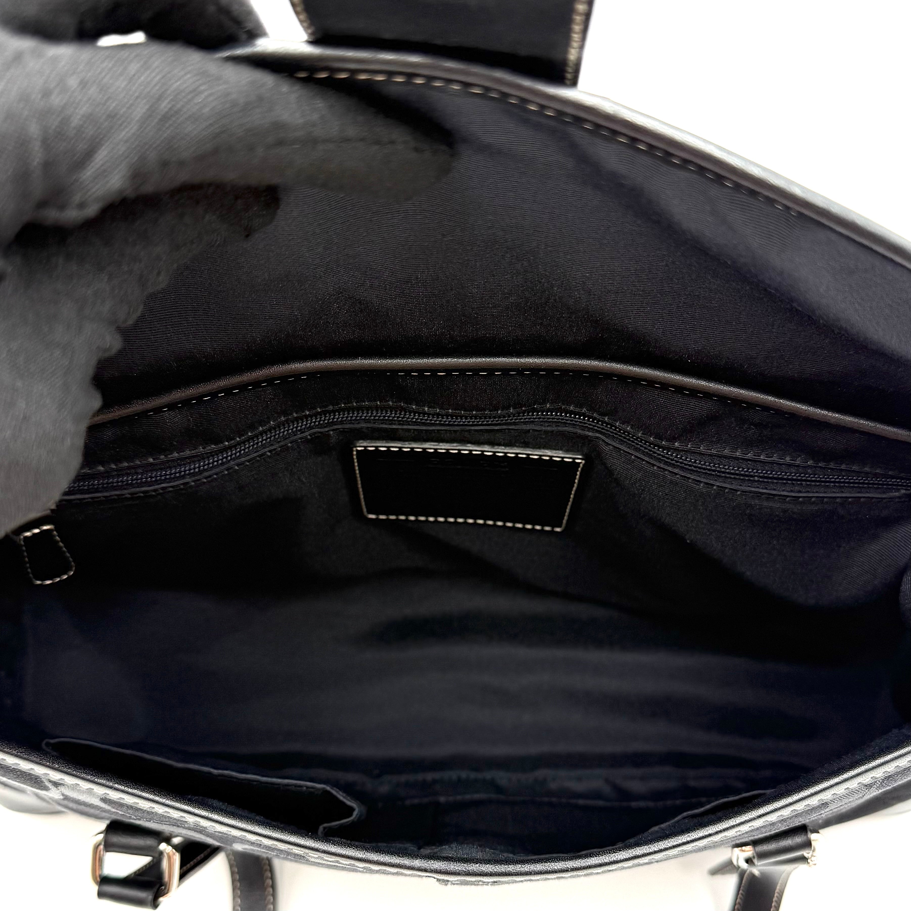 Coach black Soho Hampton Buckle Flap Shoulder Bag with jacquard pattern, leather trim, and silver buckle detail.