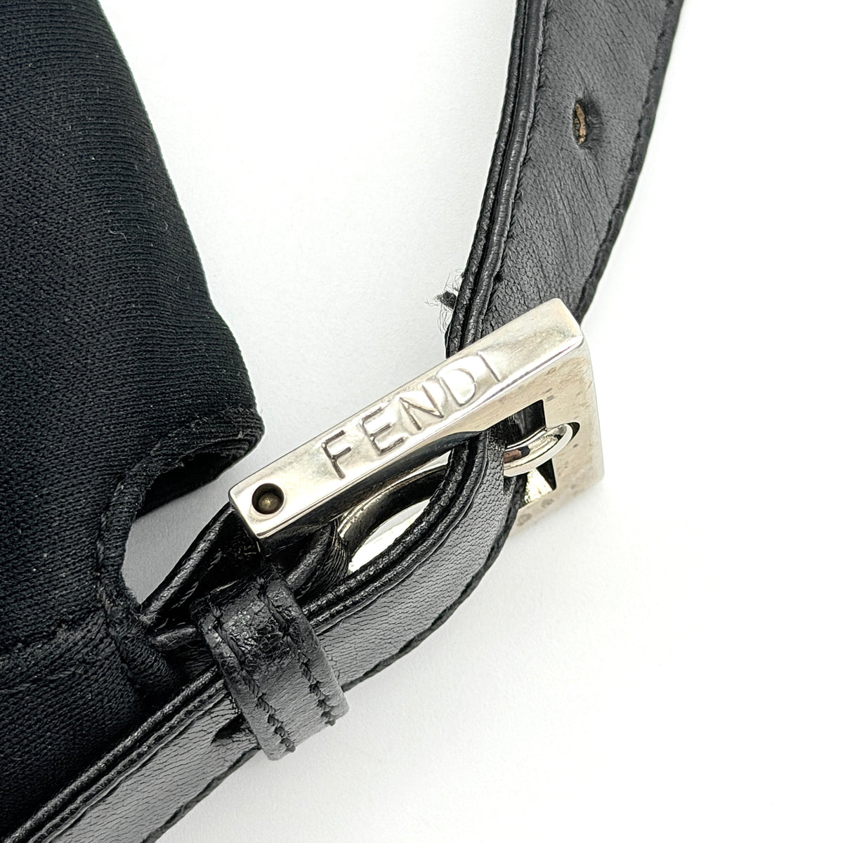 Fendi Mamma Baguette Shoulder Bag in black fabric with silver FF buckle and leather strap, photographed on a white backdrop.