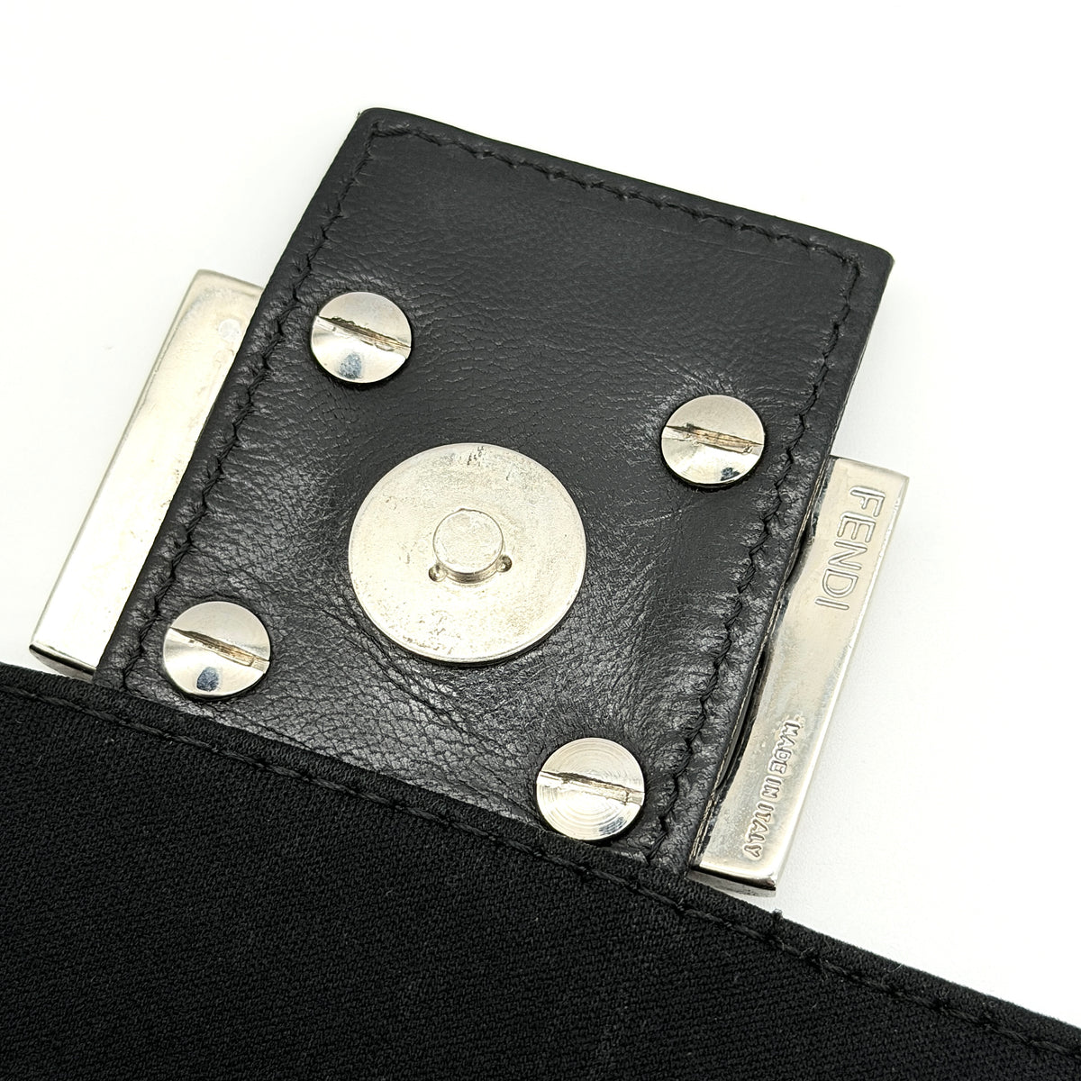 Fendi Mamma Baguette Shoulder Bag in black fabric with silver FF buckle and leather strap, photographed on a white backdrop.