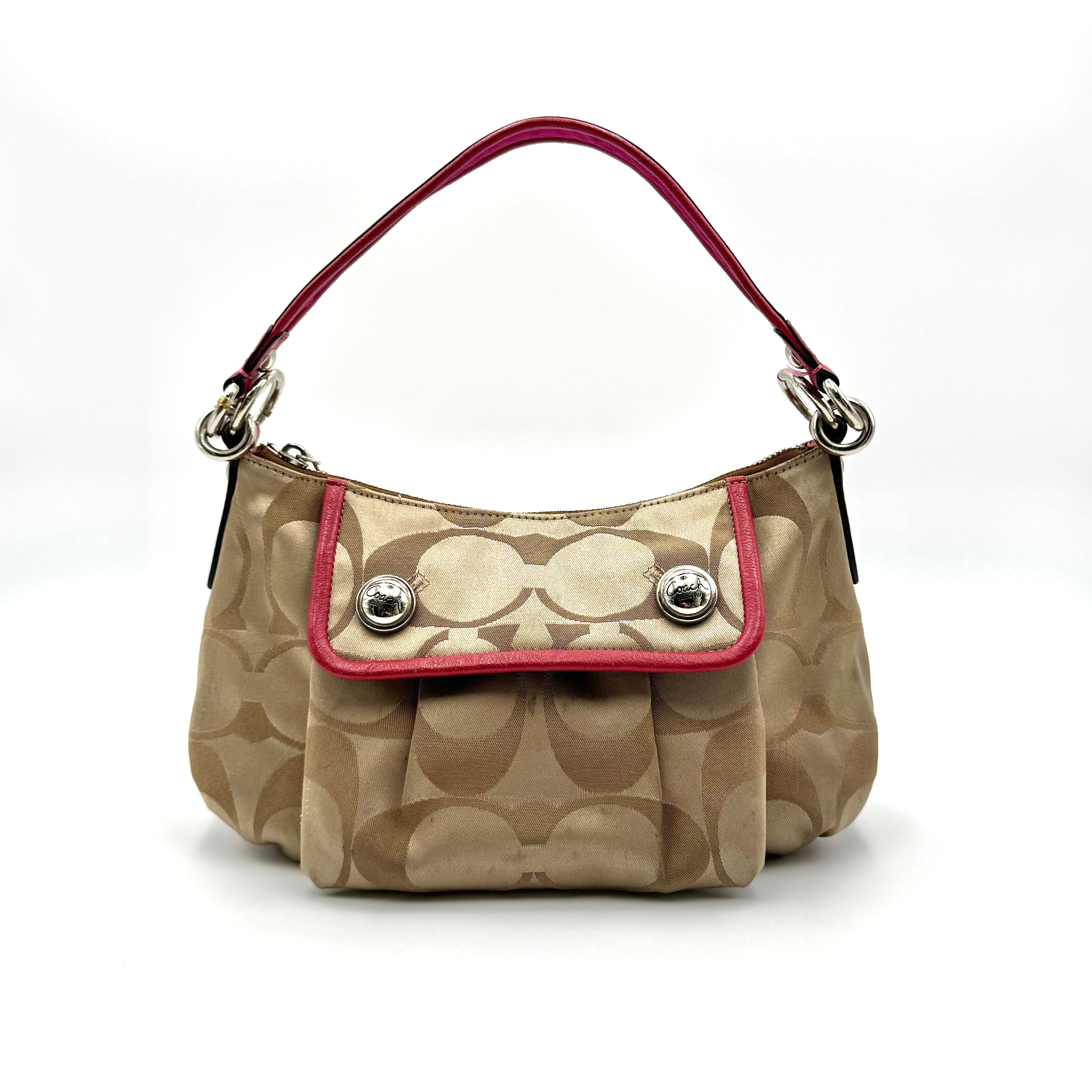 Coach Signature Poppy Sateen Groovy Shoulder Bag in beige with pink trim and detachable strap, displayed on a white background.