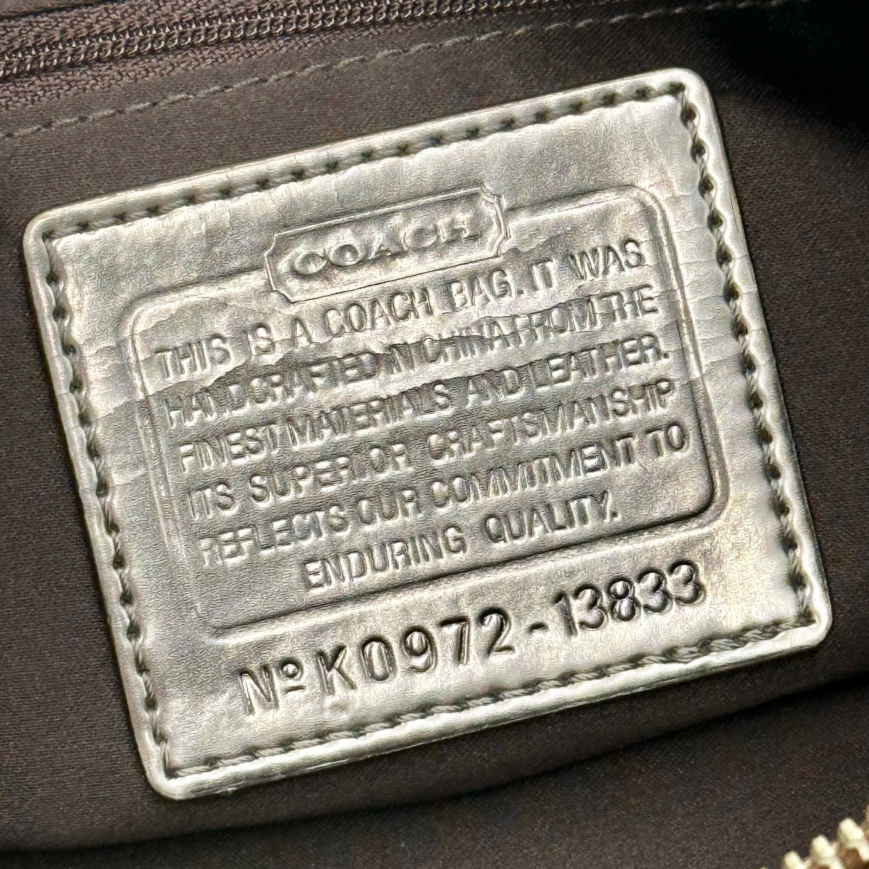 Coach Signature Poppy Sateen Groovy Shoulder Bag in beige with pink trim and detachable strap, displayed on a white background.