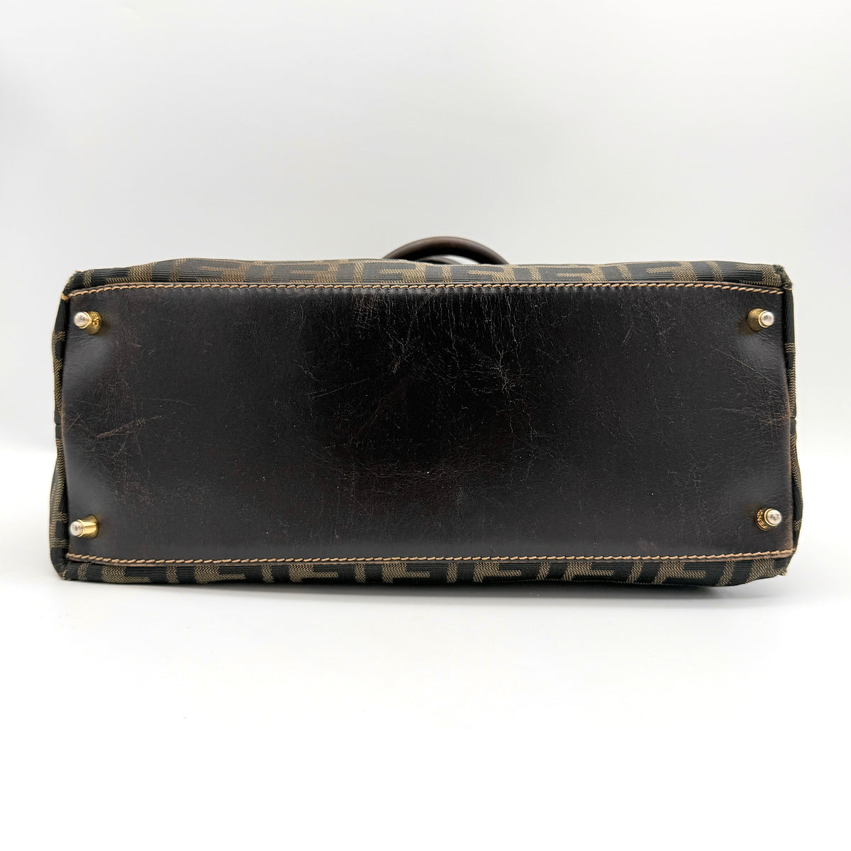 Fendi Zucca FF Monogram Handbag in brown canvas with leather handles and gold hardware, displayed against a clean background.