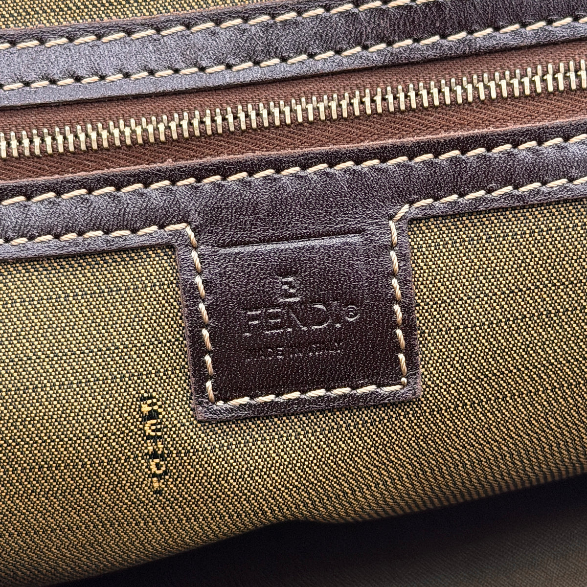 Fendi Zucca FF Monogram Handbag in brown canvas with leather handles and gold hardware, displayed against a clean background.