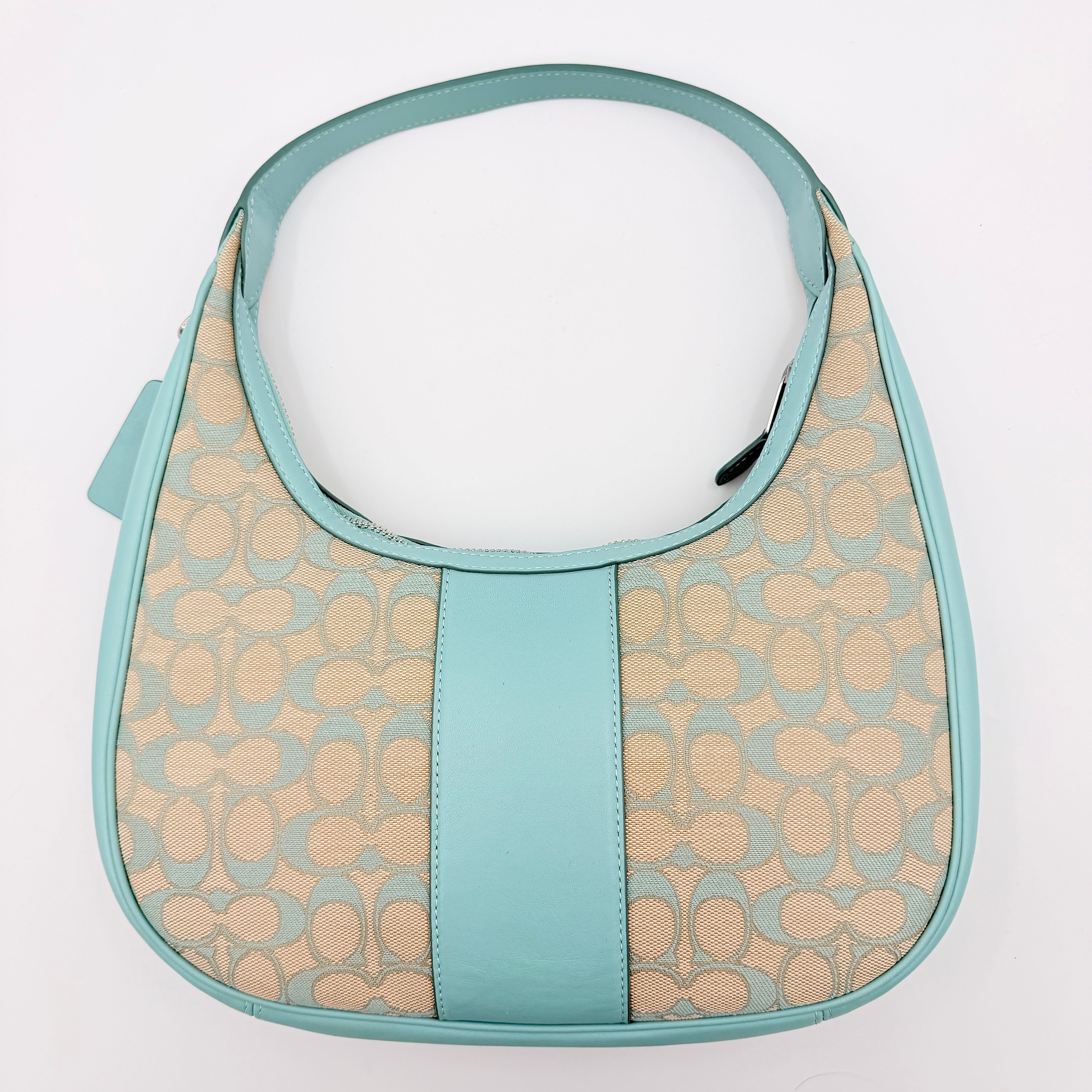 Coach Signature Carmen Shoulder Bag in beige and blue canvas with powder blue leather trim and silver hardware, photographed on white background.