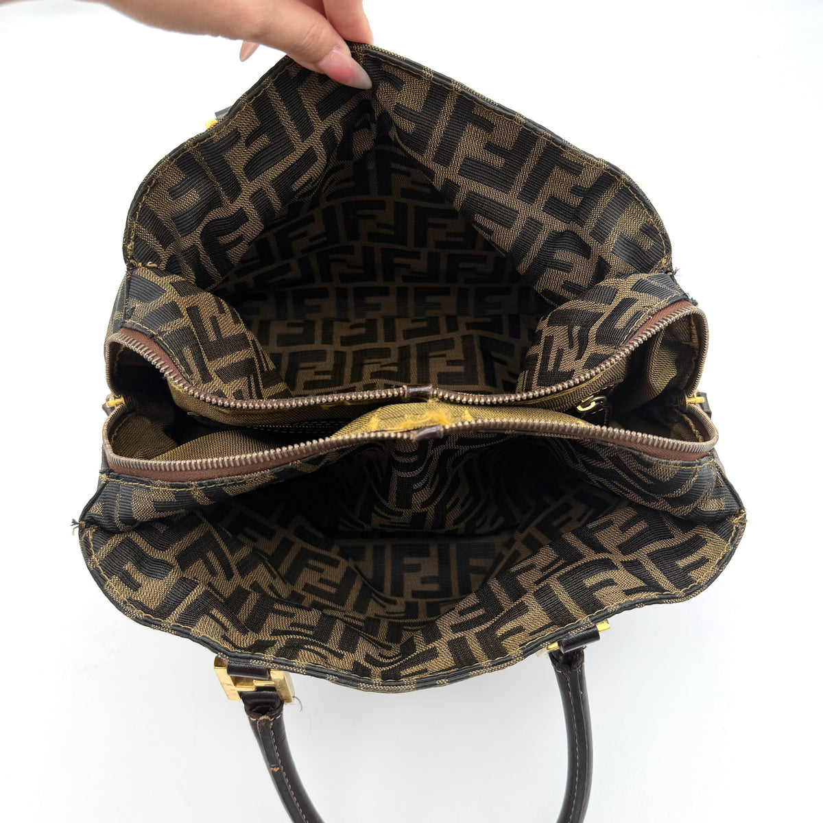Fendi Zucca FF Monogram Handbag in brown canvas with leather handles and gold hardware, displayed against a clean background.