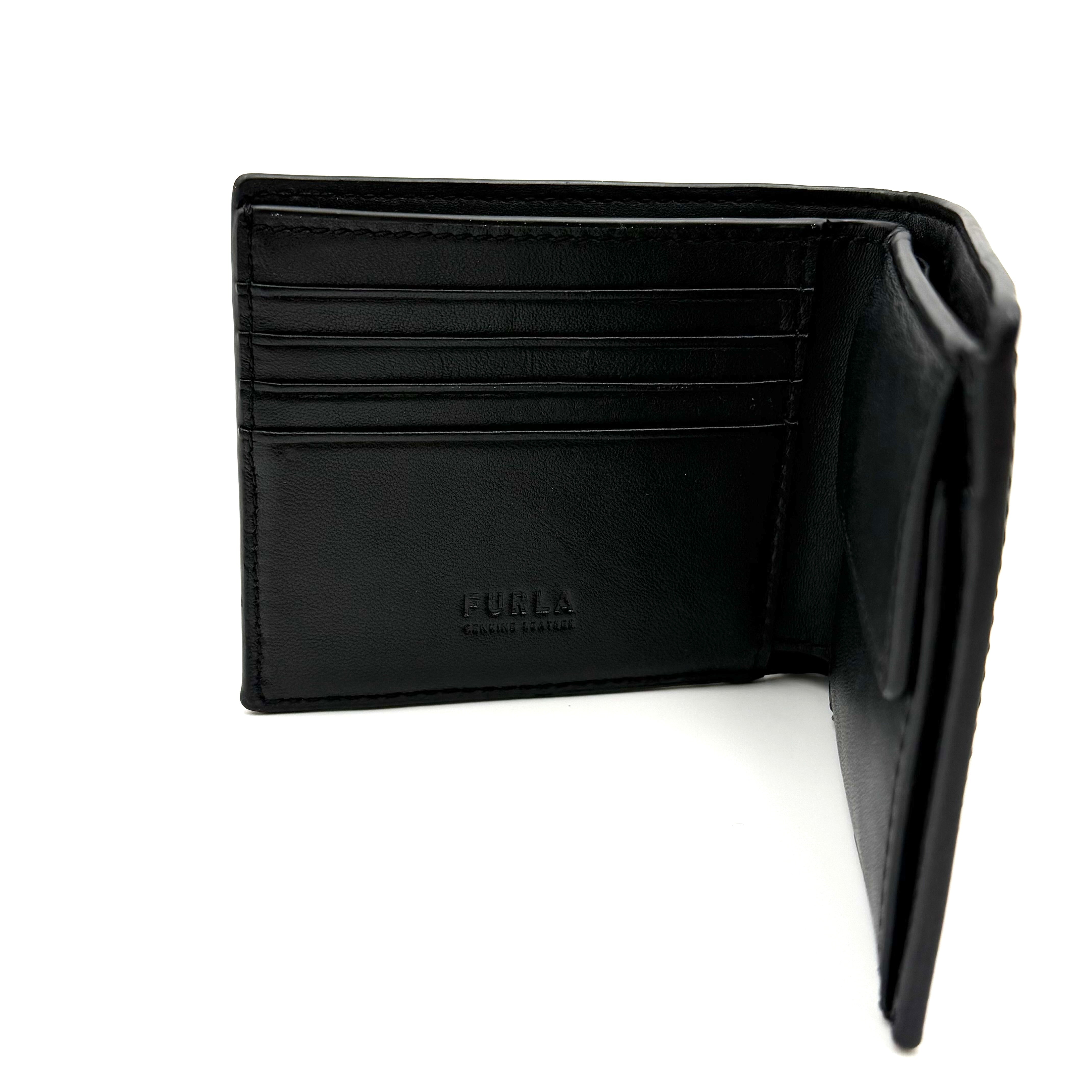 Furla Man Cosmo black leather bifold wallet with a textured teddy bear patch on the front.