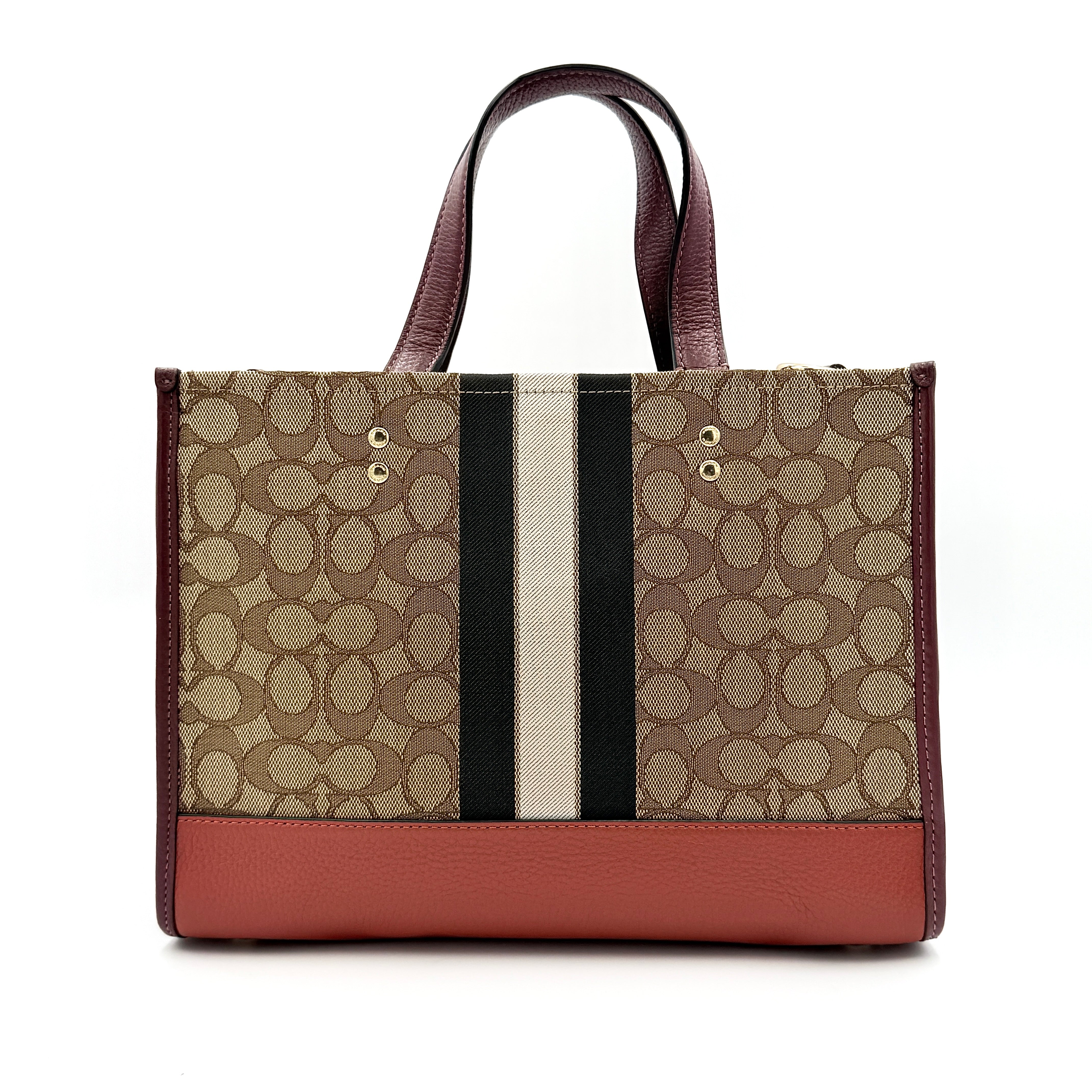 Coach 2Way Signature 22 Dempsey Tote in brown jacquard and burgundy leather with orange logo patch, shown with detachable strap.