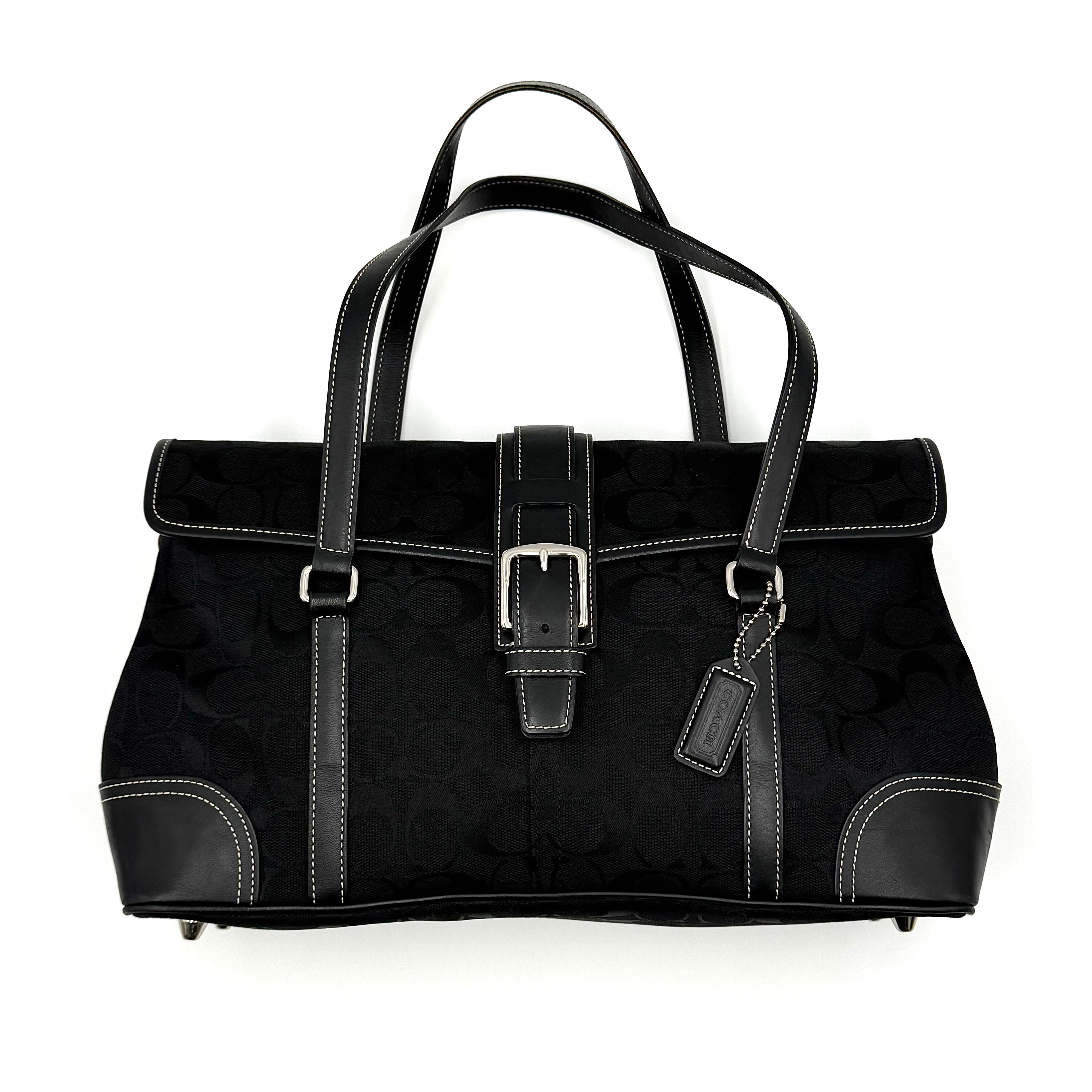 Coach black Soho Hampton Buckle Flap Shoulder Bag with jacquard pattern, leather trim, and silver buckle detail.