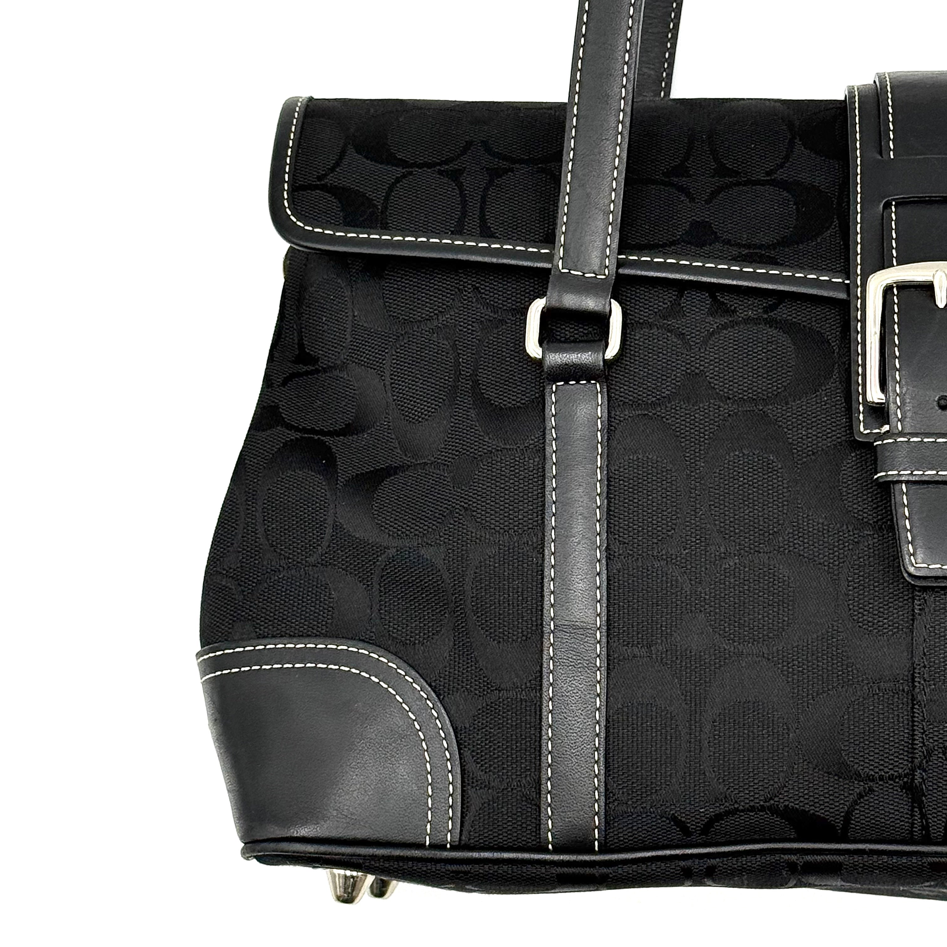 Coach black Soho Hampton Buckle Flap Shoulder Bag with jacquard pattern, leather trim, and silver buckle detail.