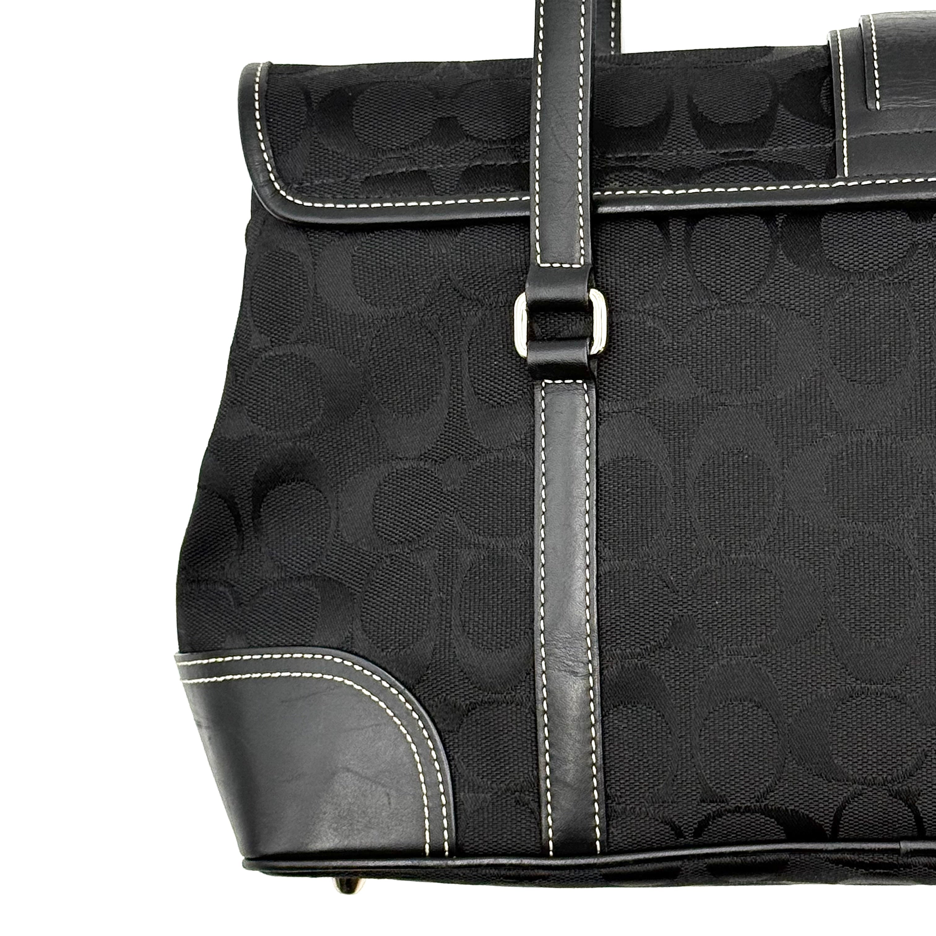 Coach black Soho Hampton Buckle Flap Shoulder Bag with jacquard pattern, leather trim, and silver buckle detail.