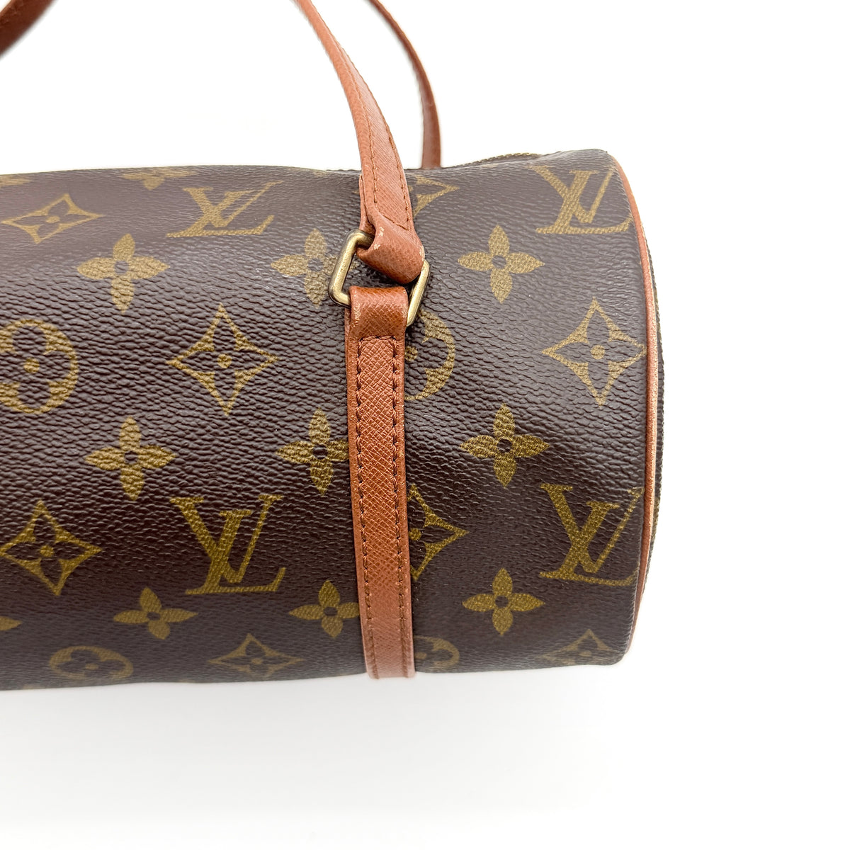 Louis Vuitton Papillon 26 in monogram canvas with leather handles and gold zipper, shown on a white background.