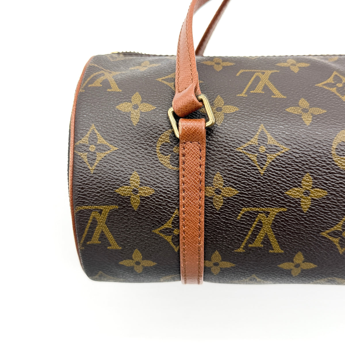 Louis Vuitton Papillon 26 in monogram canvas with leather handles and gold zipper, shown on a white background.