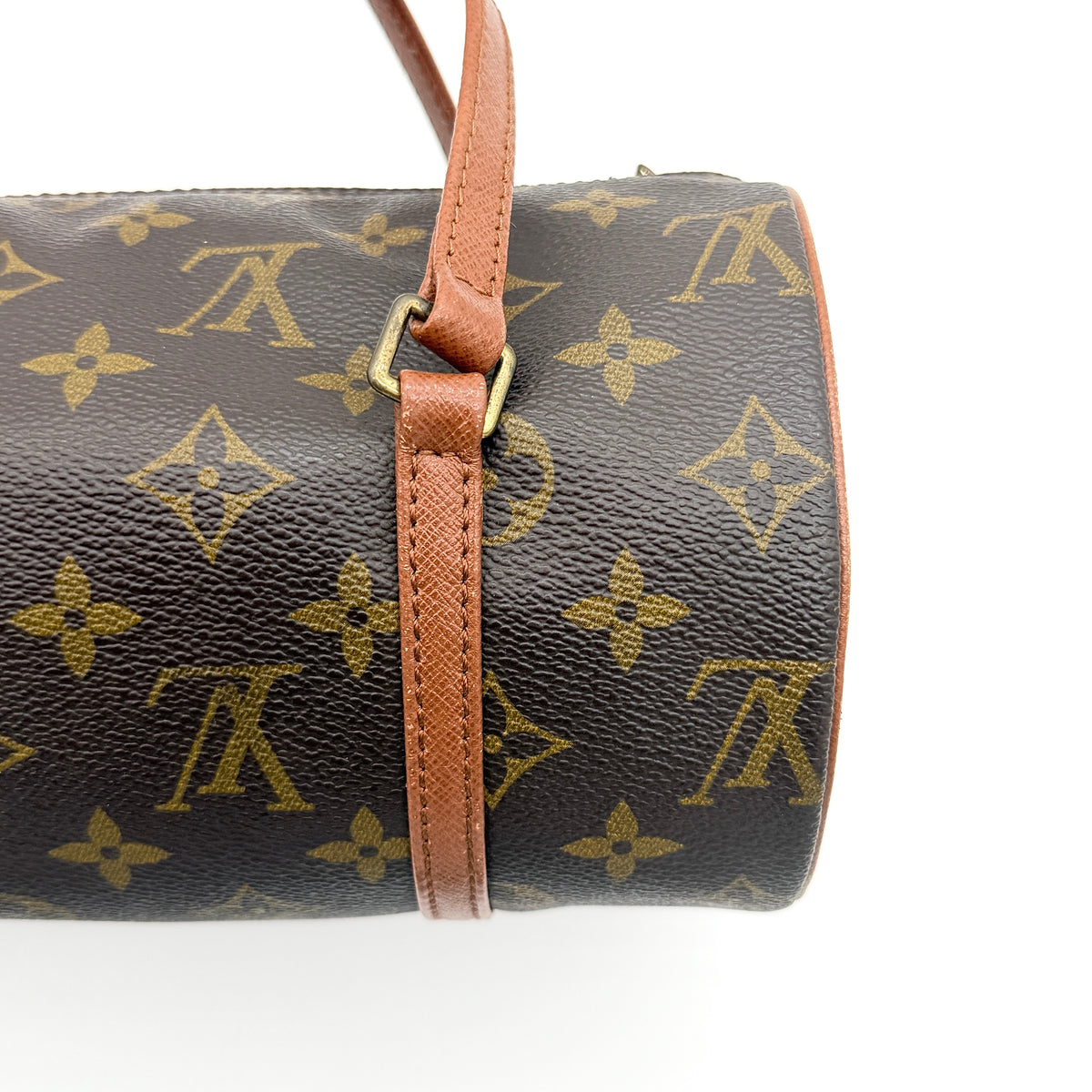 Louis Vuitton Papillon 26 in monogram canvas with leather handles and gold zipper, shown on a white background.