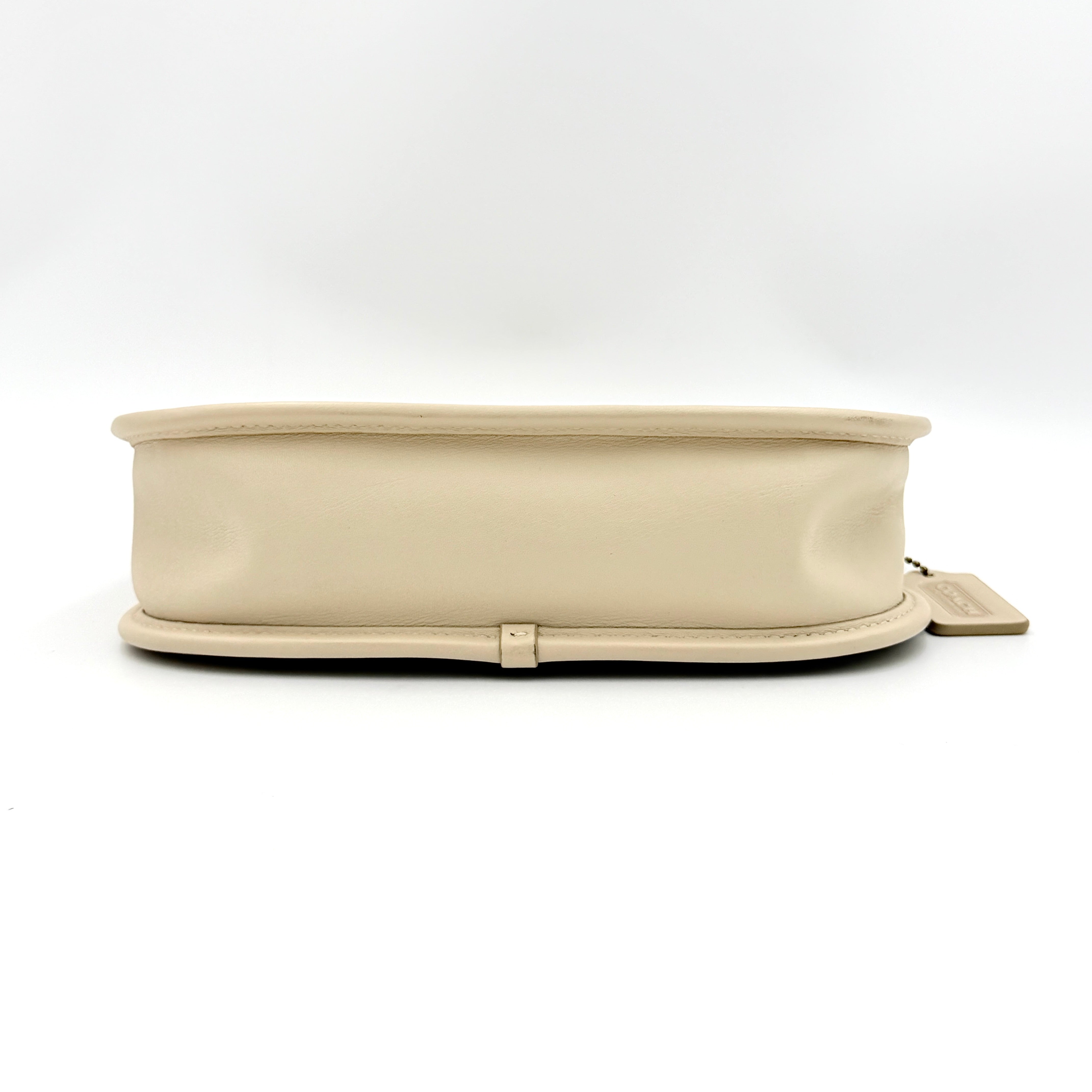 Coach Swinger 20 Stripe shoulder bag in grey and beige canvas with cream leather trim, shown with detachable strap and gold hardware.