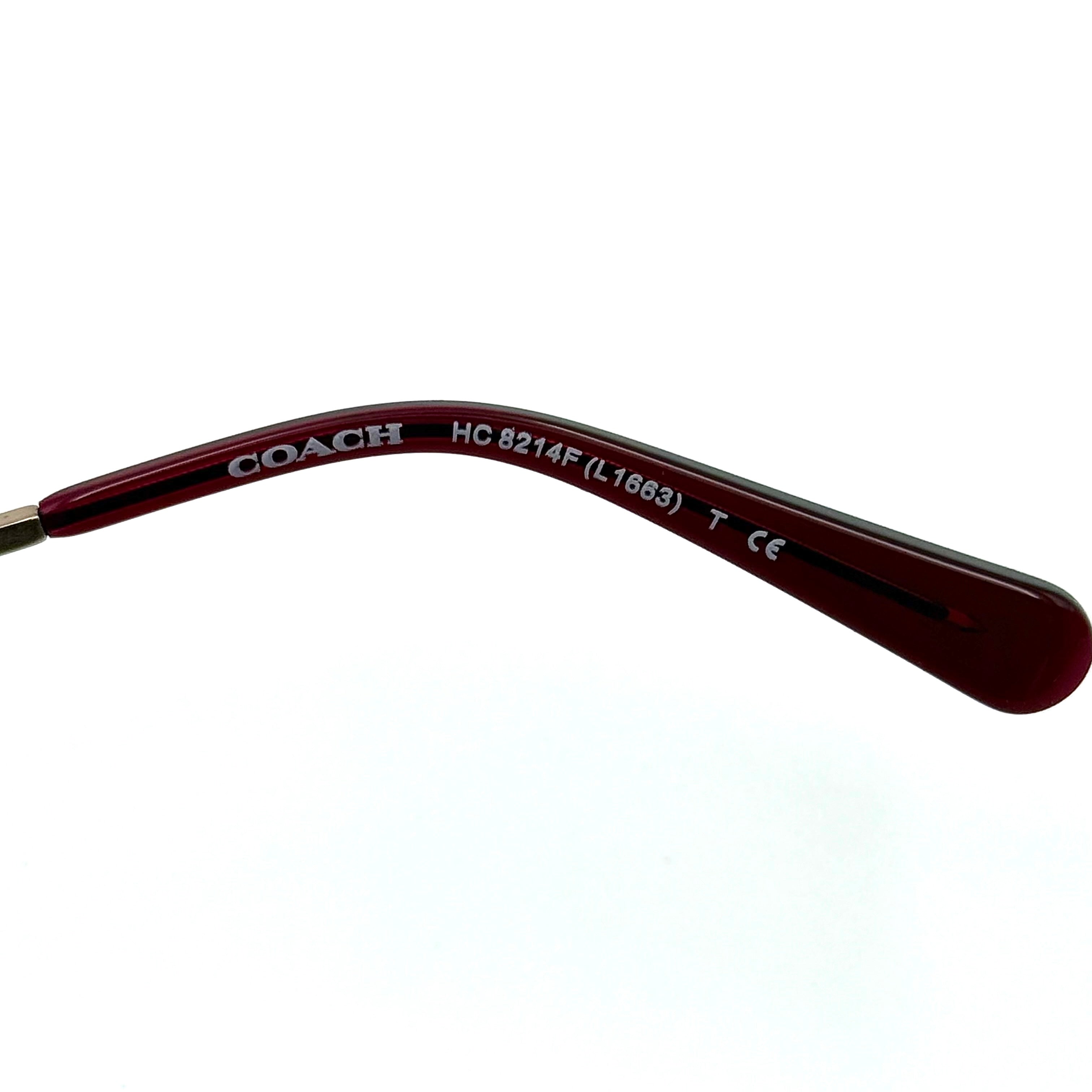 Coach HC8214F sunglasses in a red-to-sand gradient acetate frame with gold-tone metal temples and signature carriage detail.