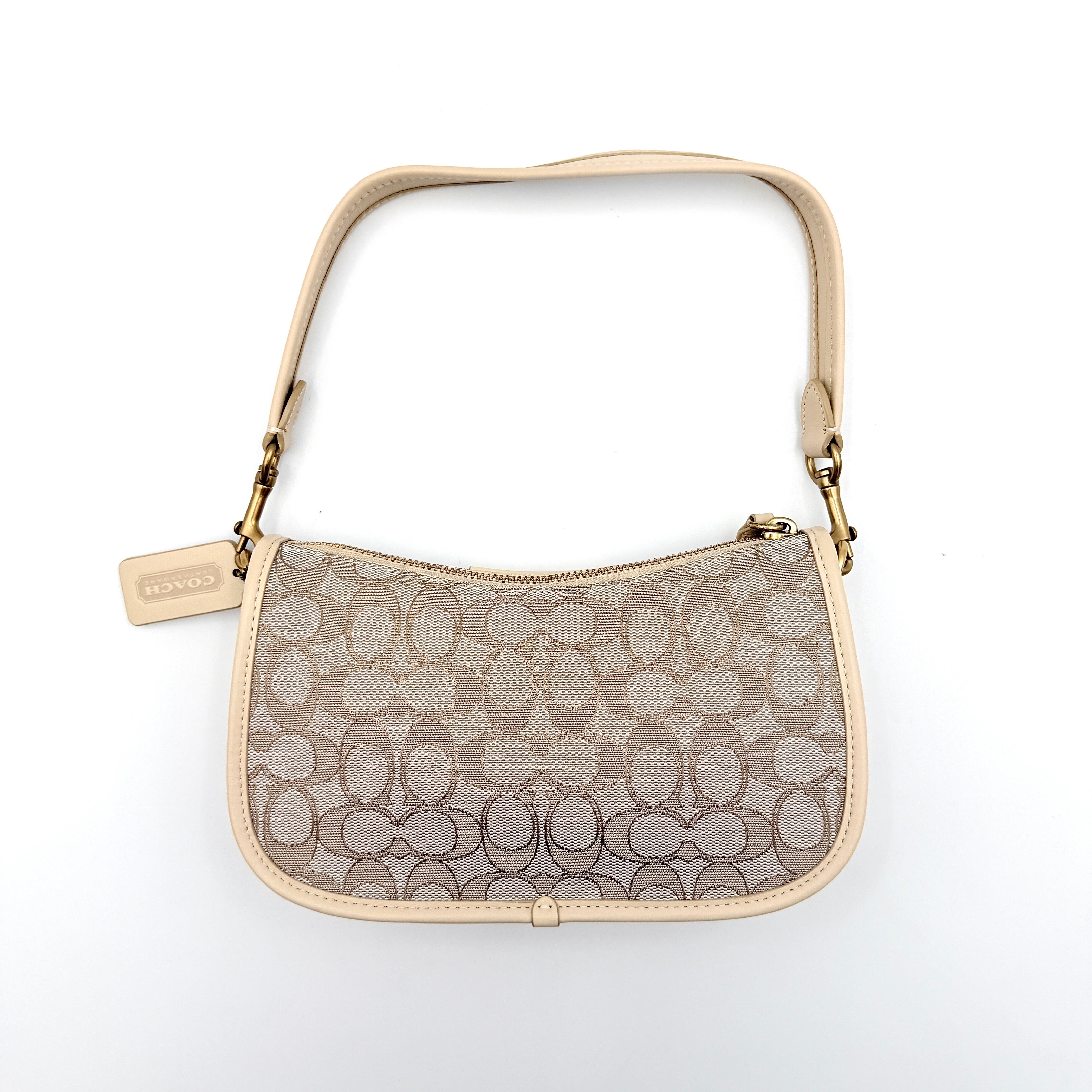 Coach Swinger 20 Stripe shoulder bag in grey and beige canvas with cream leather trim, shown with detachable strap and gold hardware.