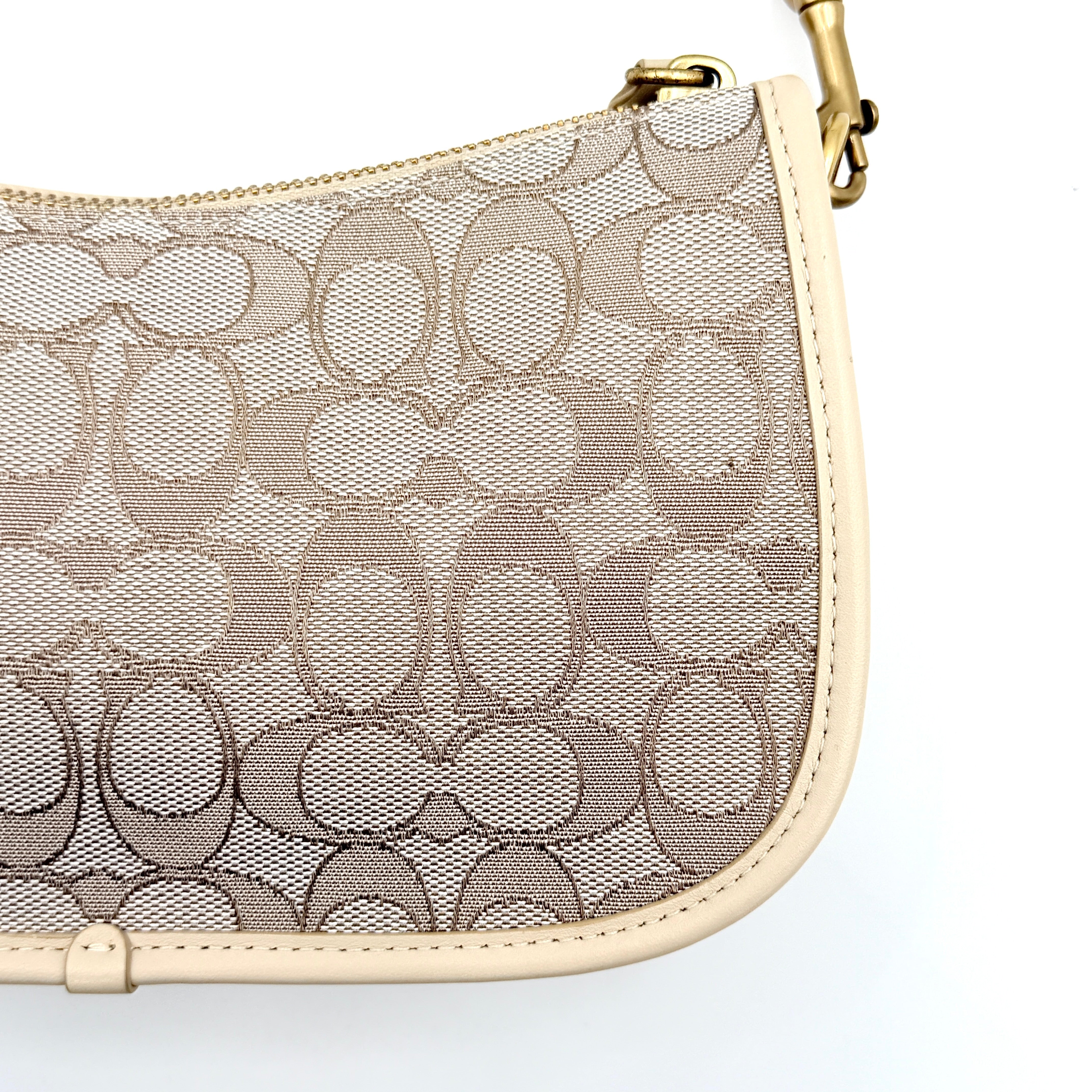 Coach Swinger 20 Stripe shoulder bag in grey and beige canvas with cream leather trim, shown with detachable strap and gold hardware.
