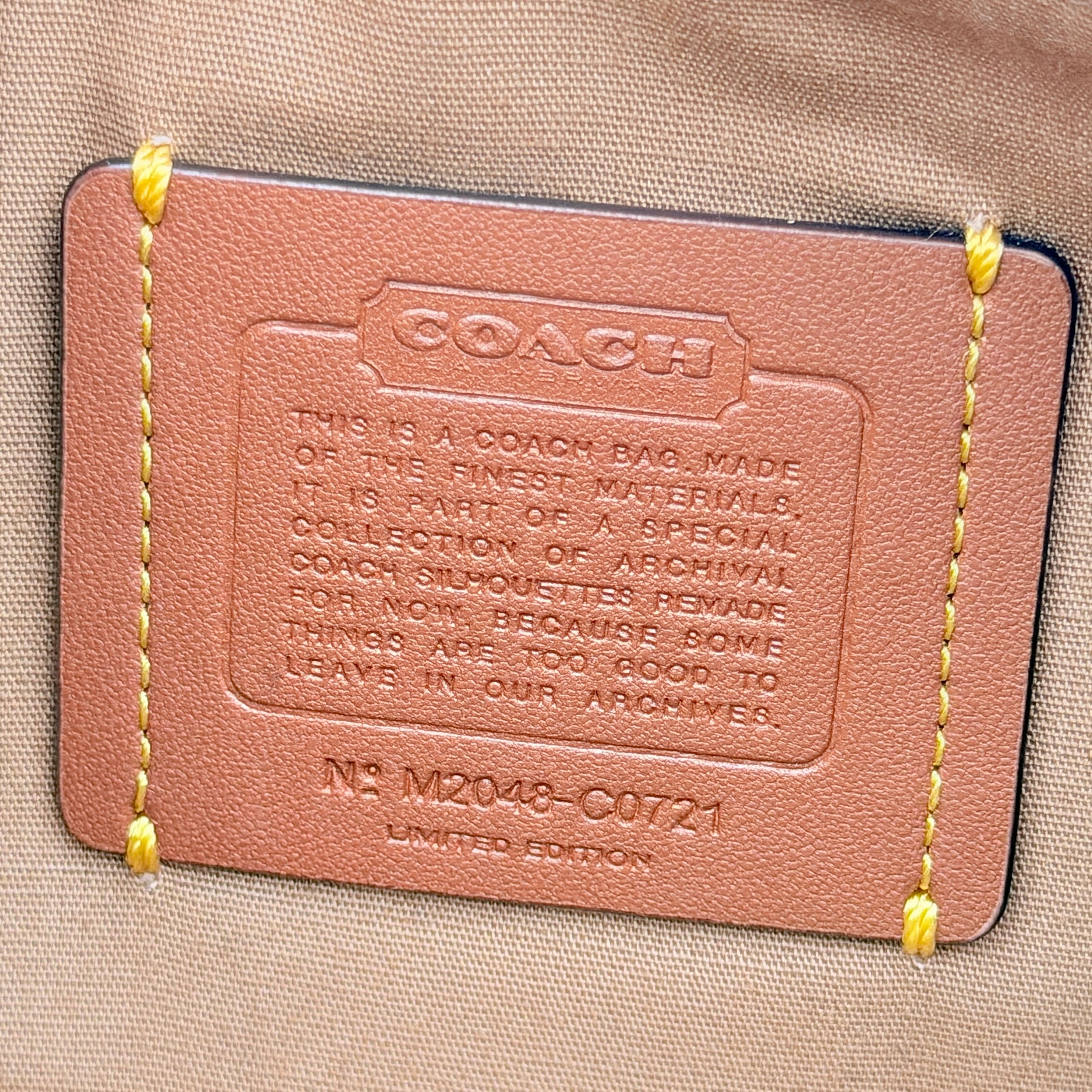 Coach Swinger 20 Stripe shoulder bag in grey and beige canvas with cream leather trim, shown with detachable strap and gold hardware.