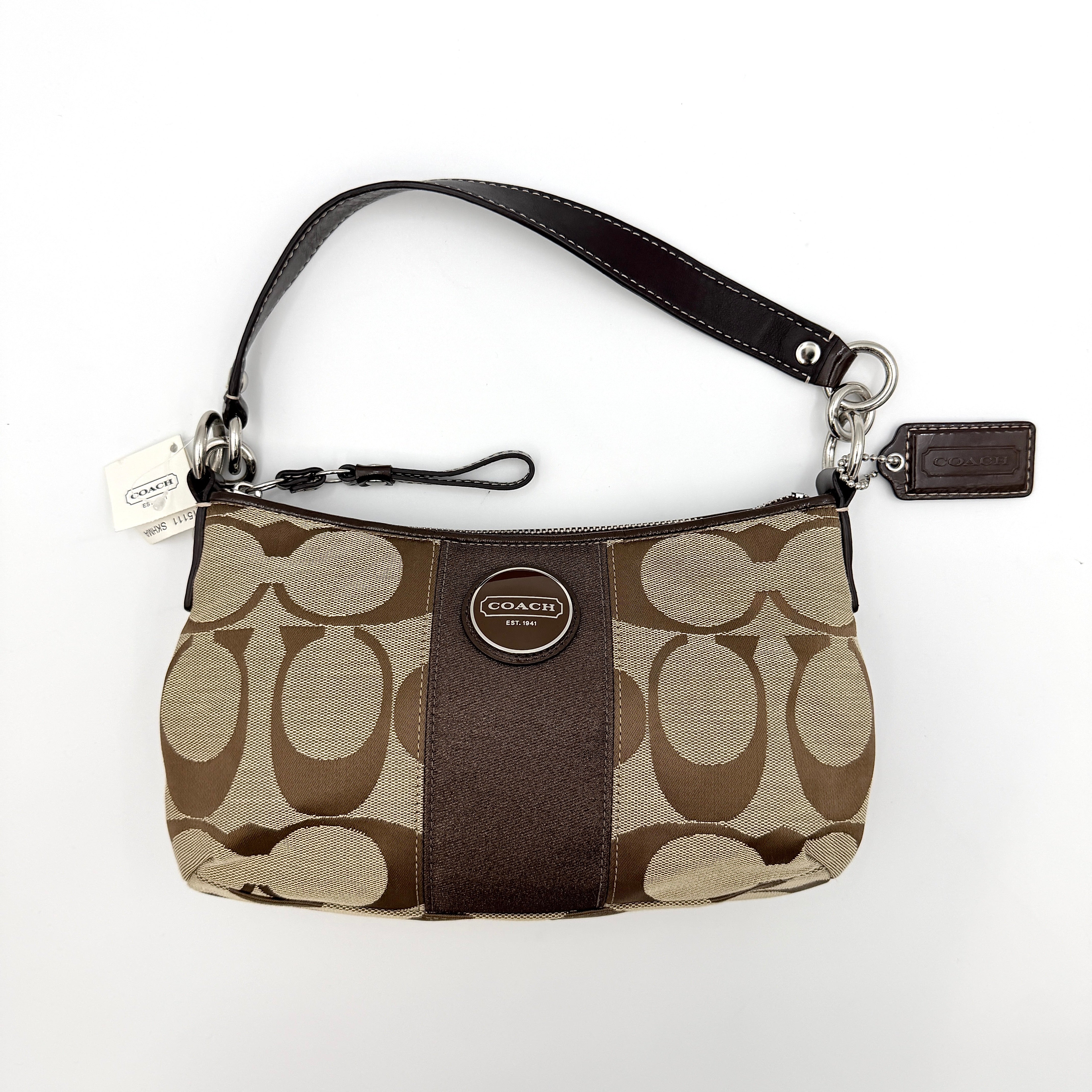 Coach khaki and mahogany signature jacquard shoulder bag with detachable strap and silver hardware displayed on a white background.