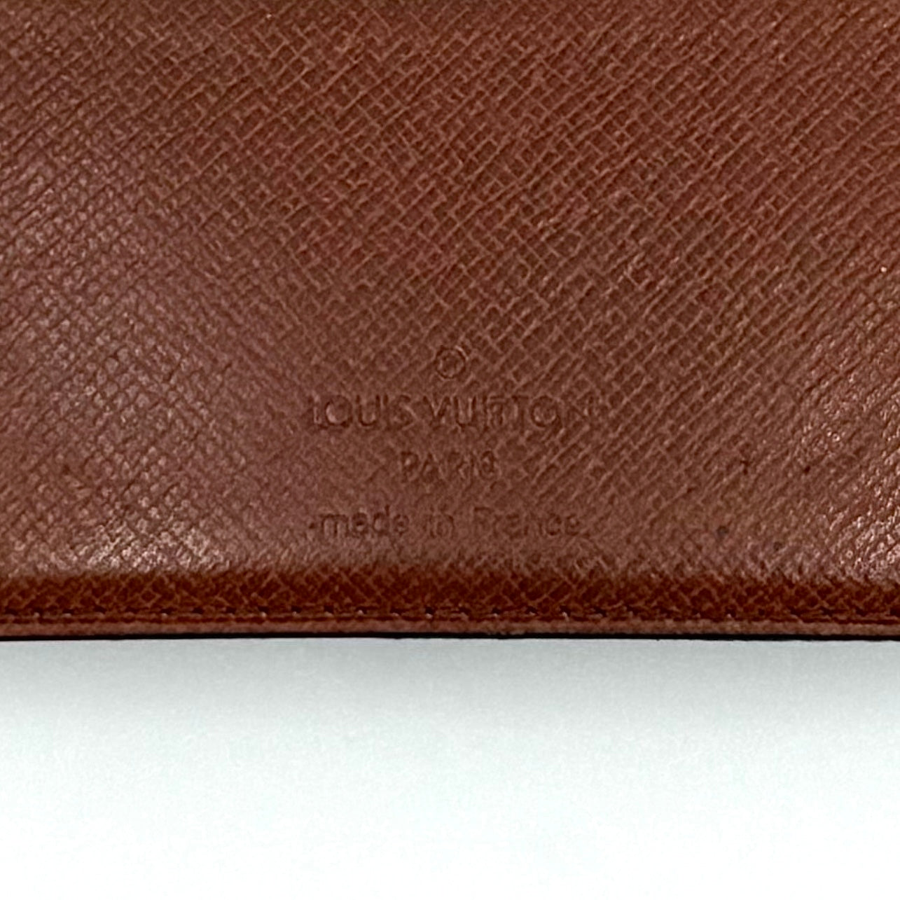 Louis Vuitton Monogram Pocket Organizer in brown canvas with the iconic LV monogram and a structured profile.