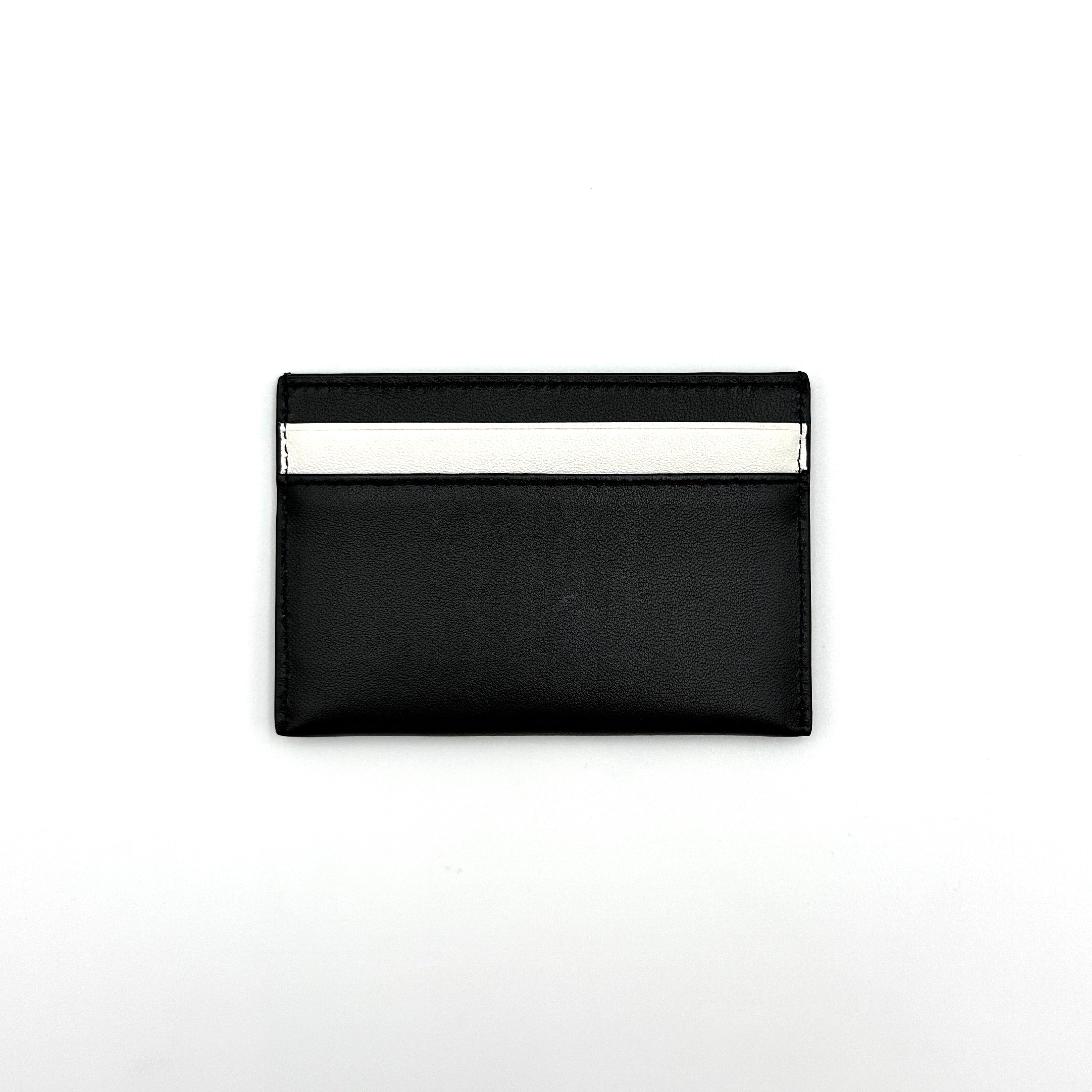 Furla WP00173 black leather cardholder with bold white logo and accent, shown against a white backdrop.