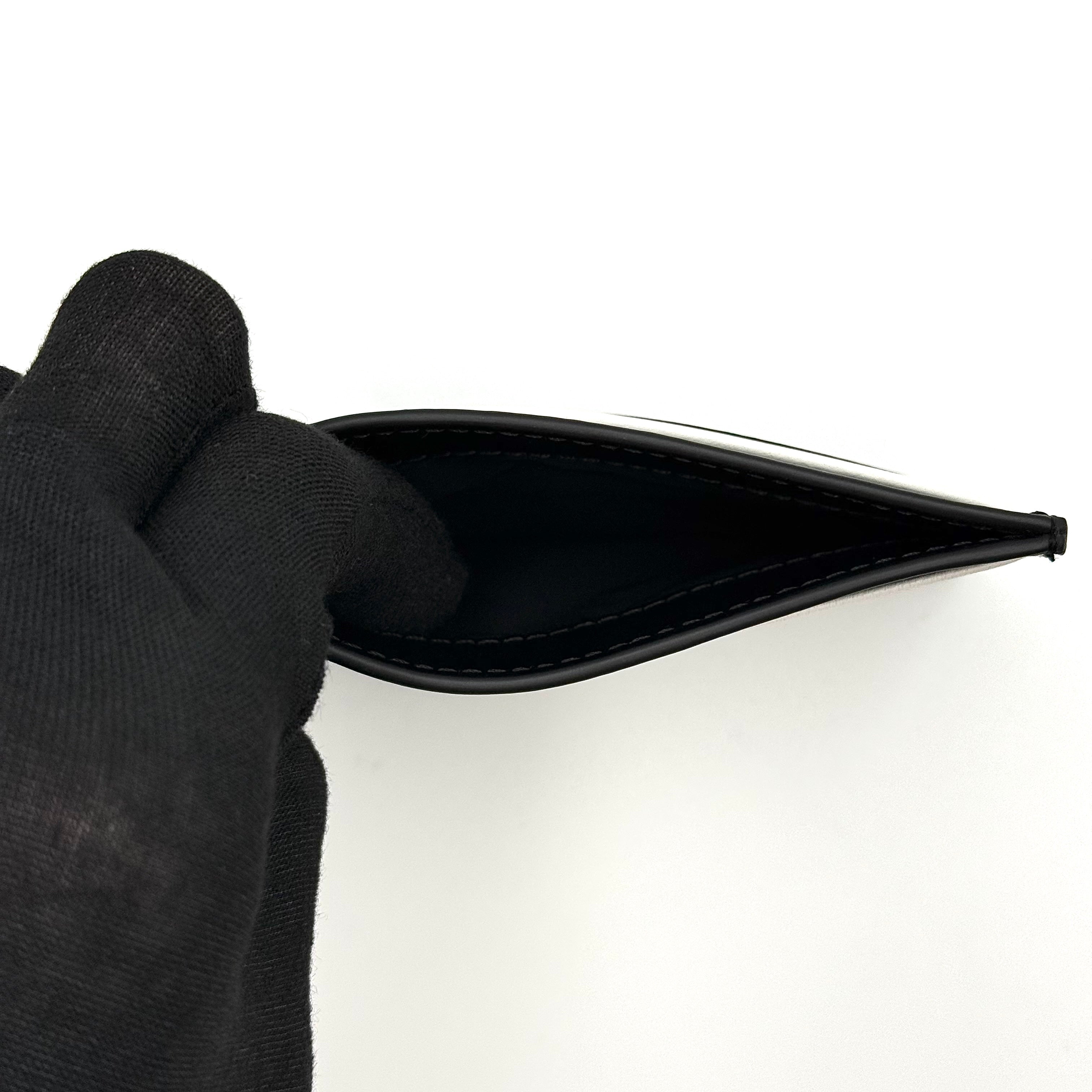 Furla WP00173 black leather cardholder with bold white logo and accent, shown against a white backdrop.