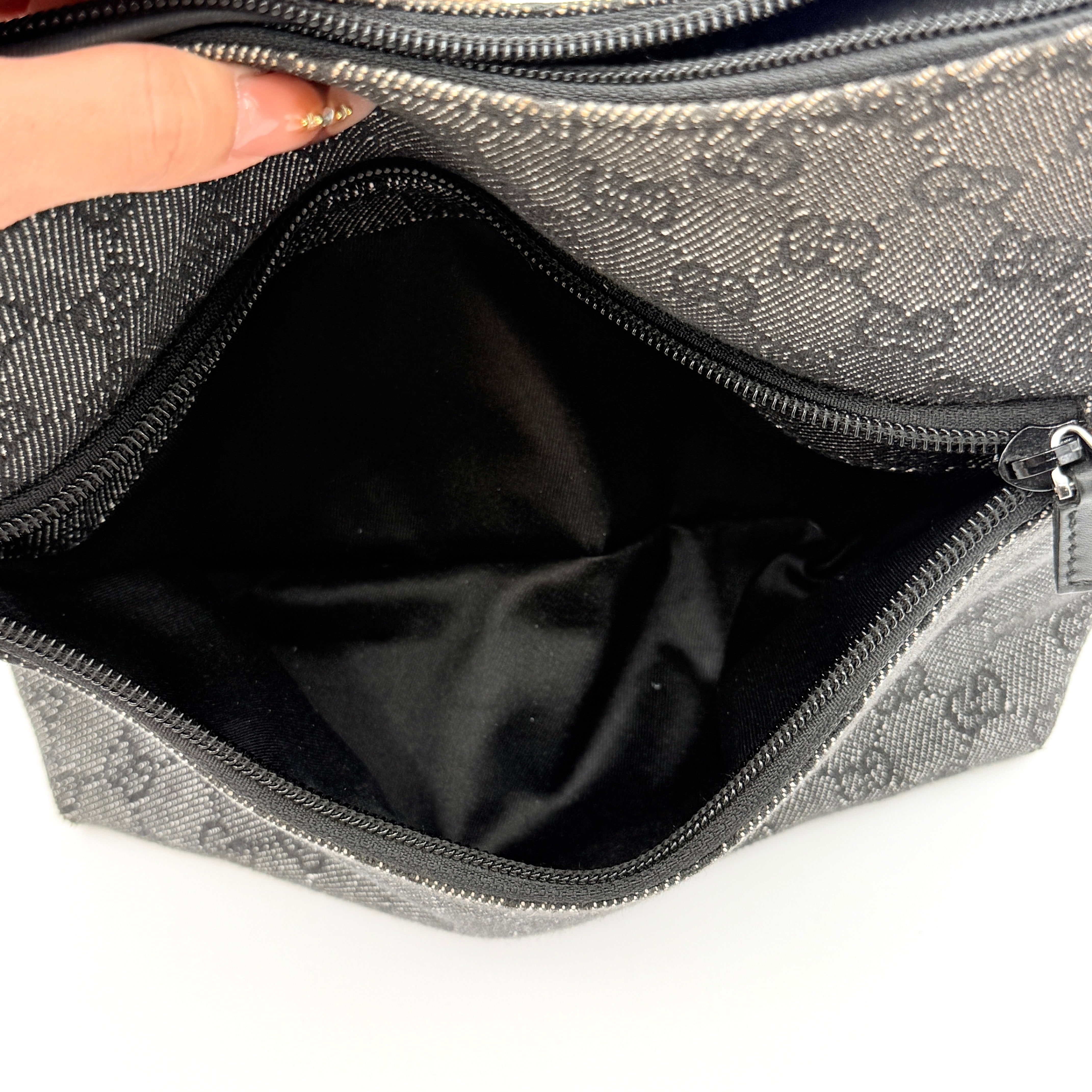 Gucci GG Monogram Hobo Shoulder Bag in black canvas with tonal GG pattern and a curved shoulder strap, photographed on a white background.