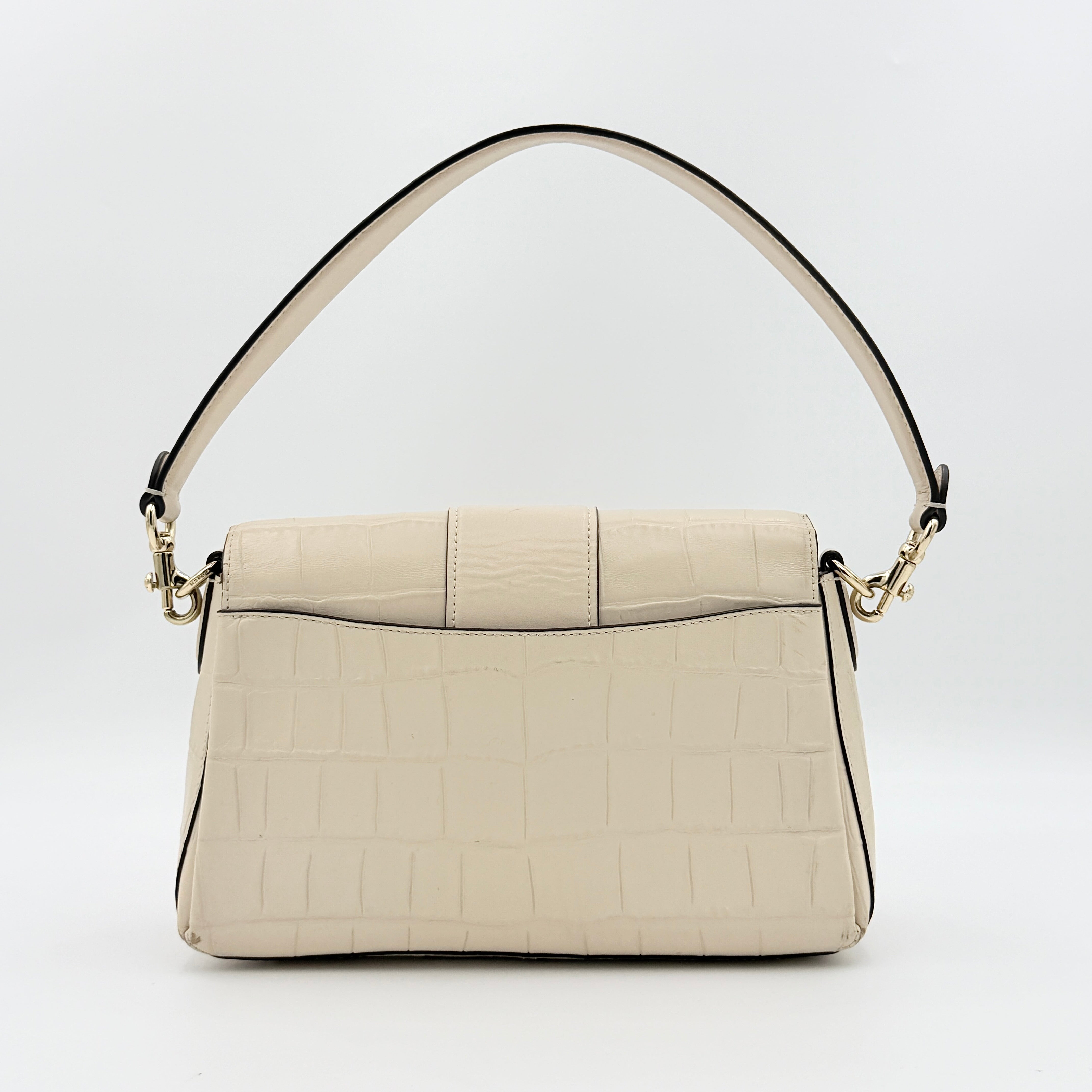 Coach Grace Shoulder Bag in ivory croc-embossed leather with gold-tone carriage plaque and structured shoulder strap.