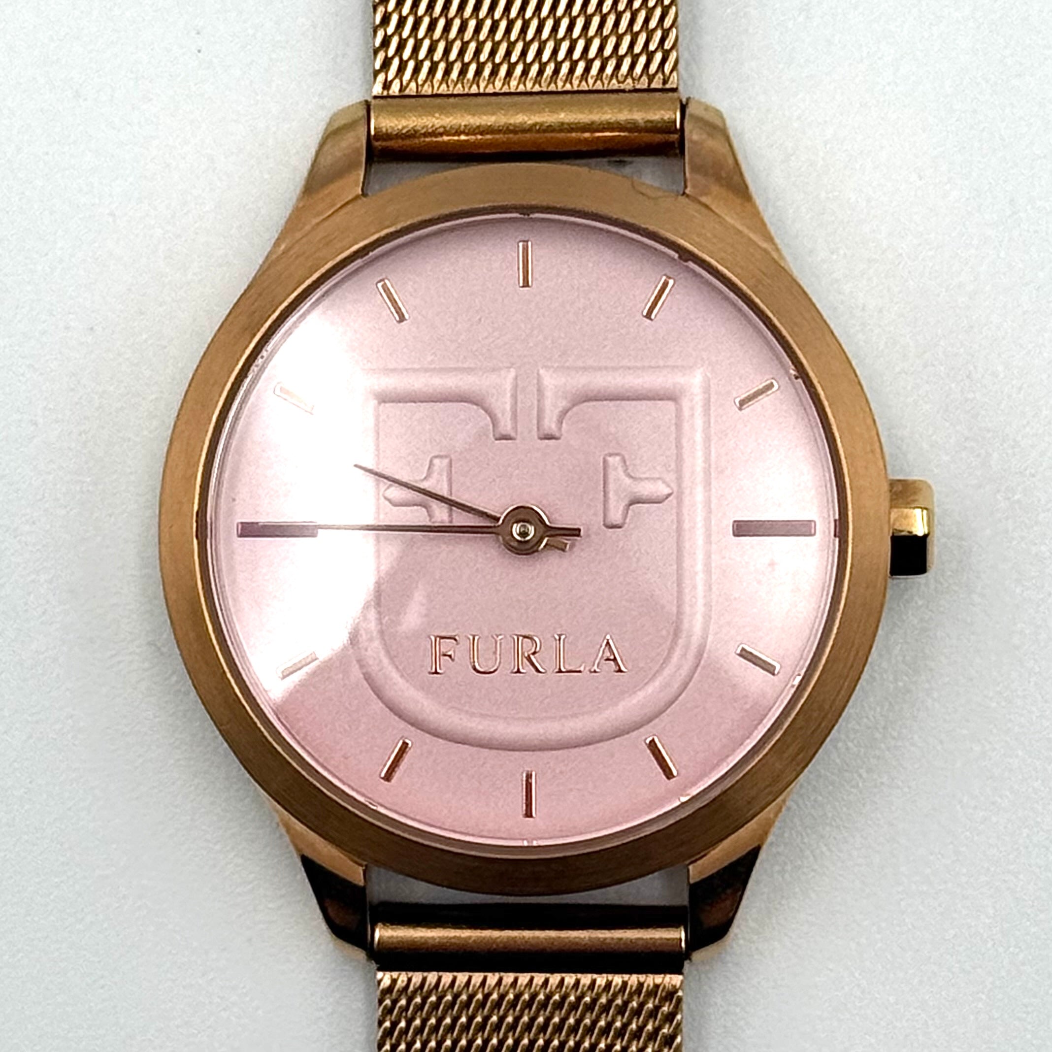Furla WR 5 ATM watch with pink dial and rose gold Milanese mesh strap displayed on a black cushion.