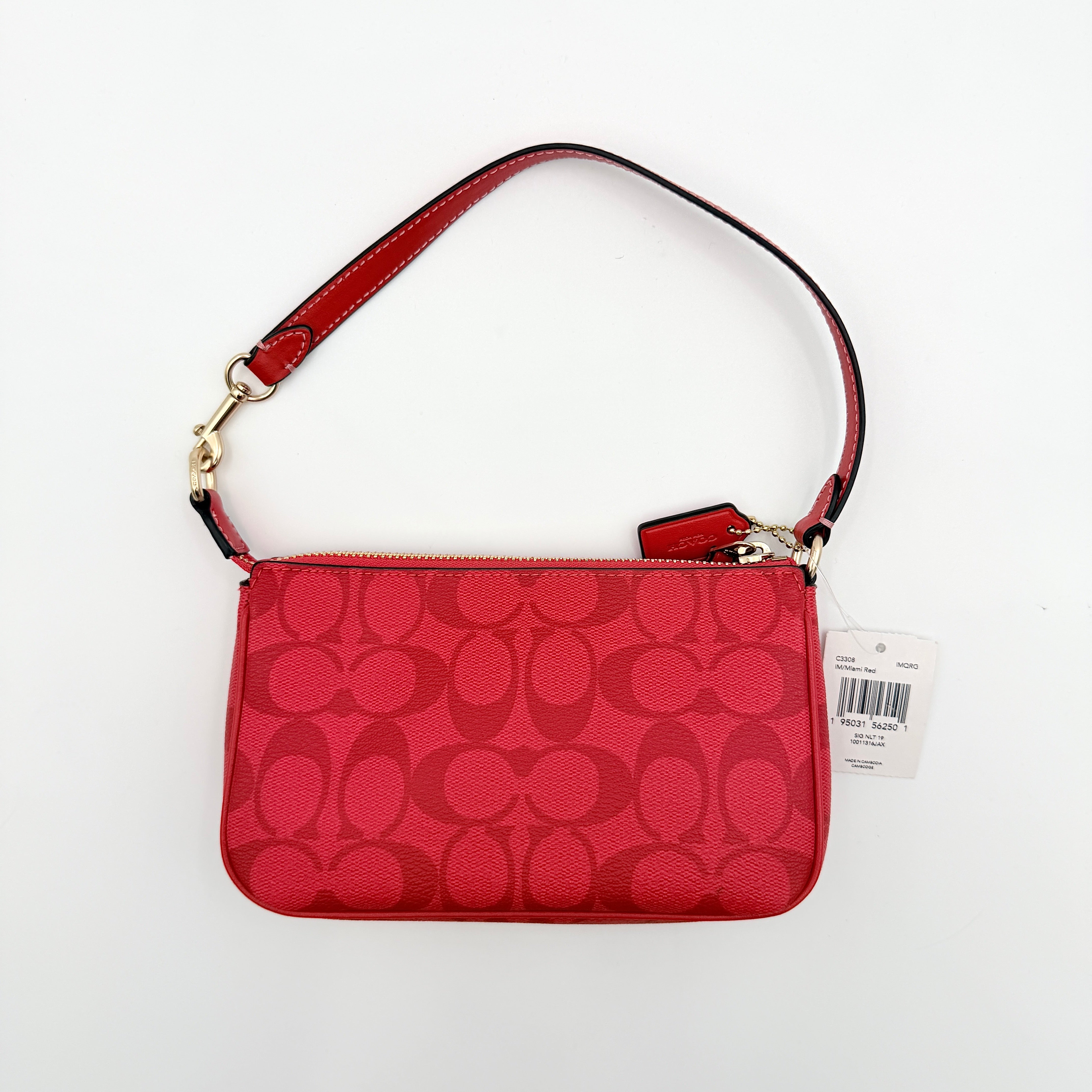 Coach Signature Nolita 19 Shoulder Bag in bright red coated canvas with signature pattern, gold-tone hardware and matching red hangtag.