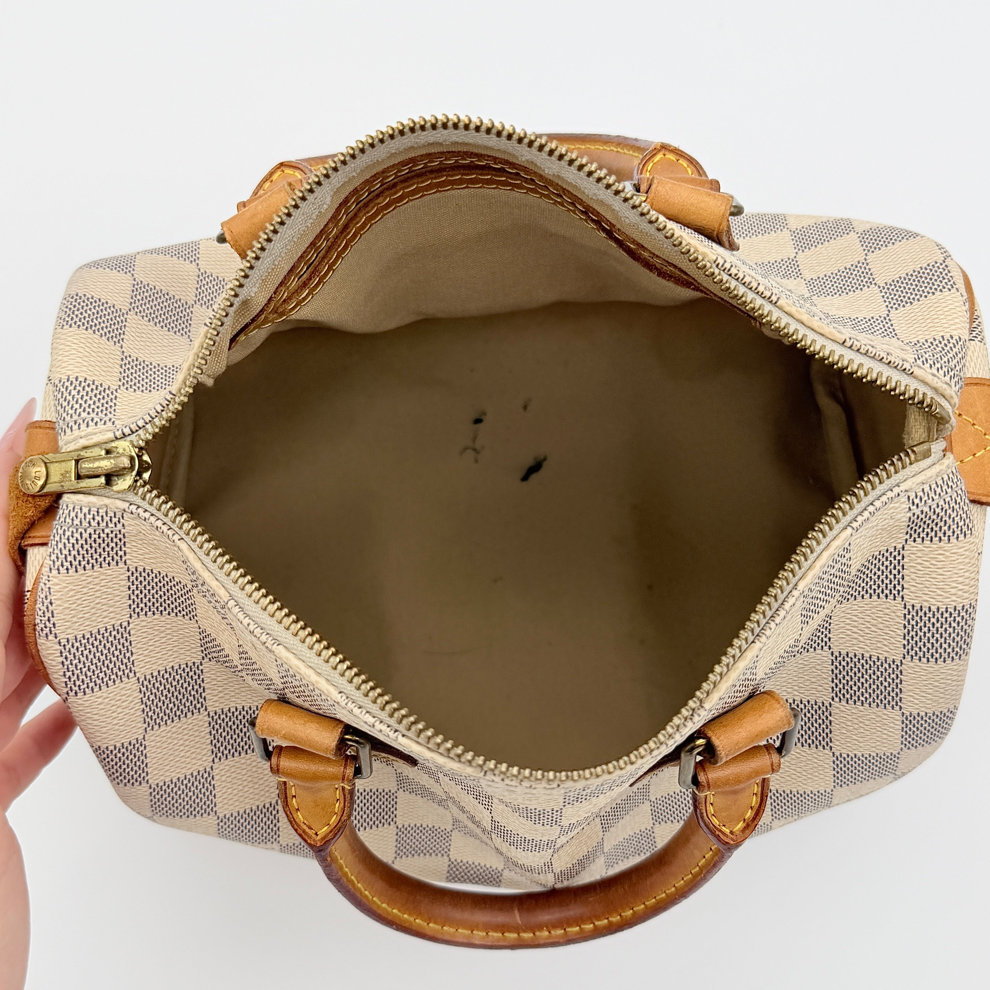 Louis Vuitton Damier Azur Speedy 25 handbag with natural leather handles, brass hardware, and included LV padlock and keys.