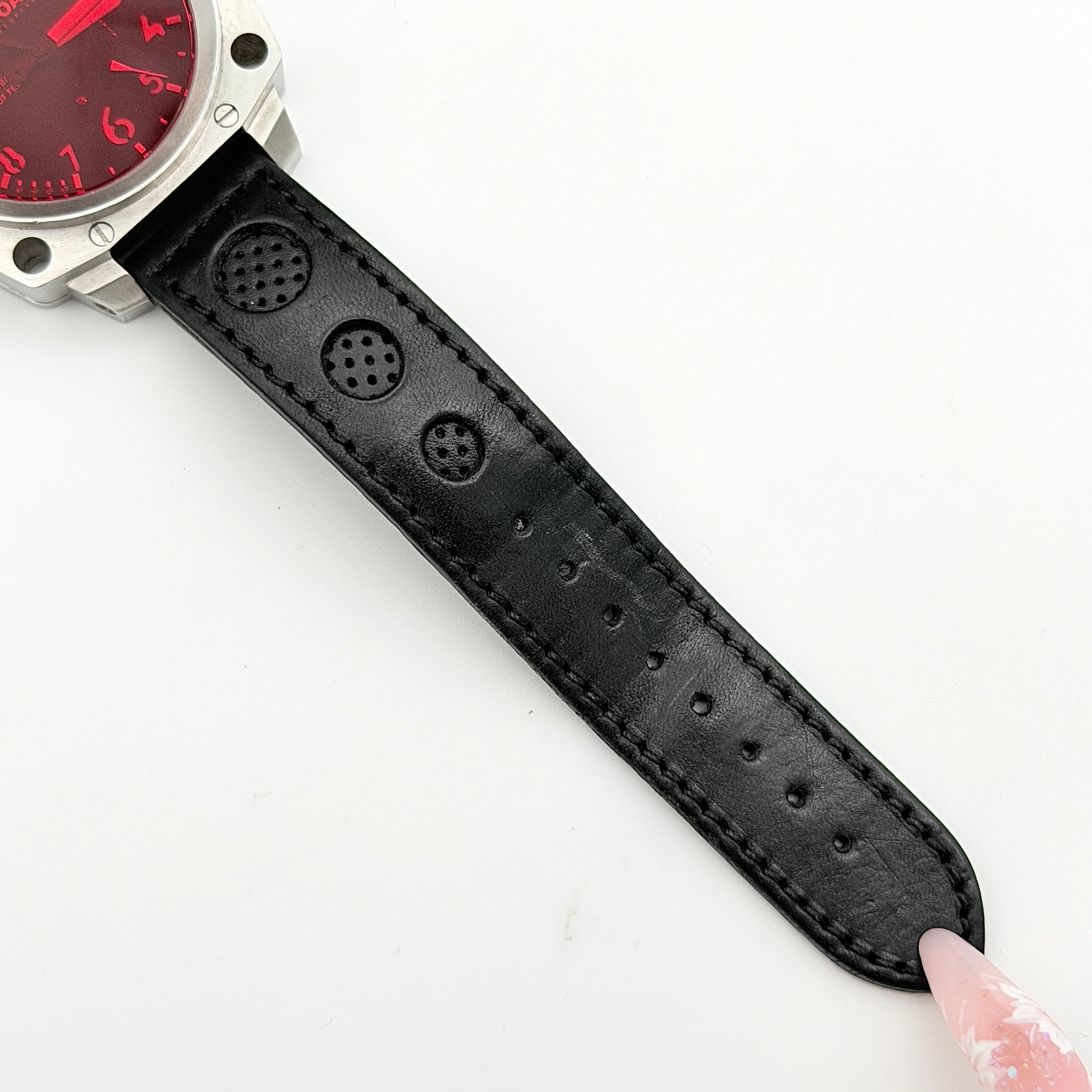 U-Boat Thousands Of Feet stainless steel watch with red dial and black leather strap, displayed on black branded box