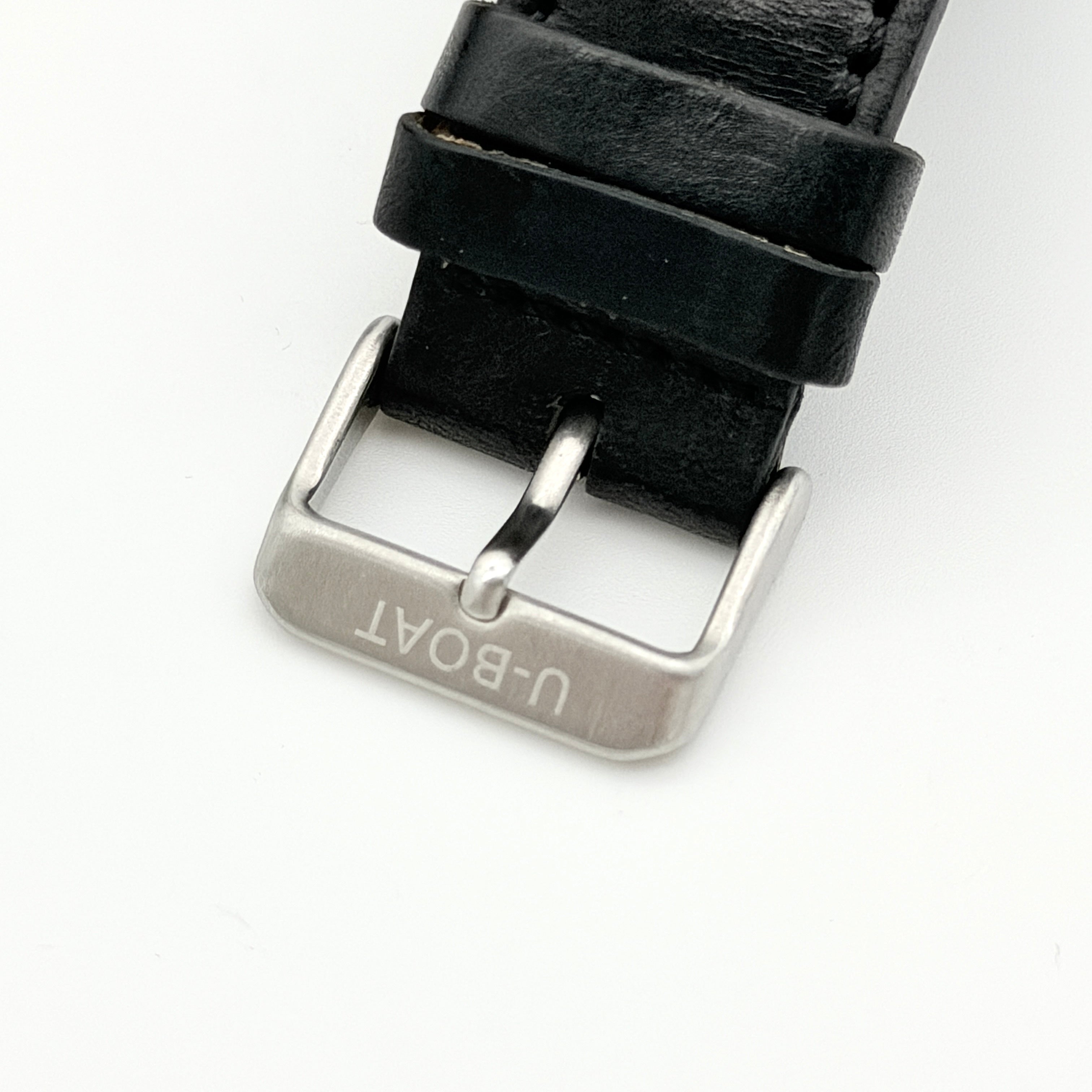 U-Boat Thousands Of Feet stainless steel watch with red dial and black leather strap, displayed on black branded box
