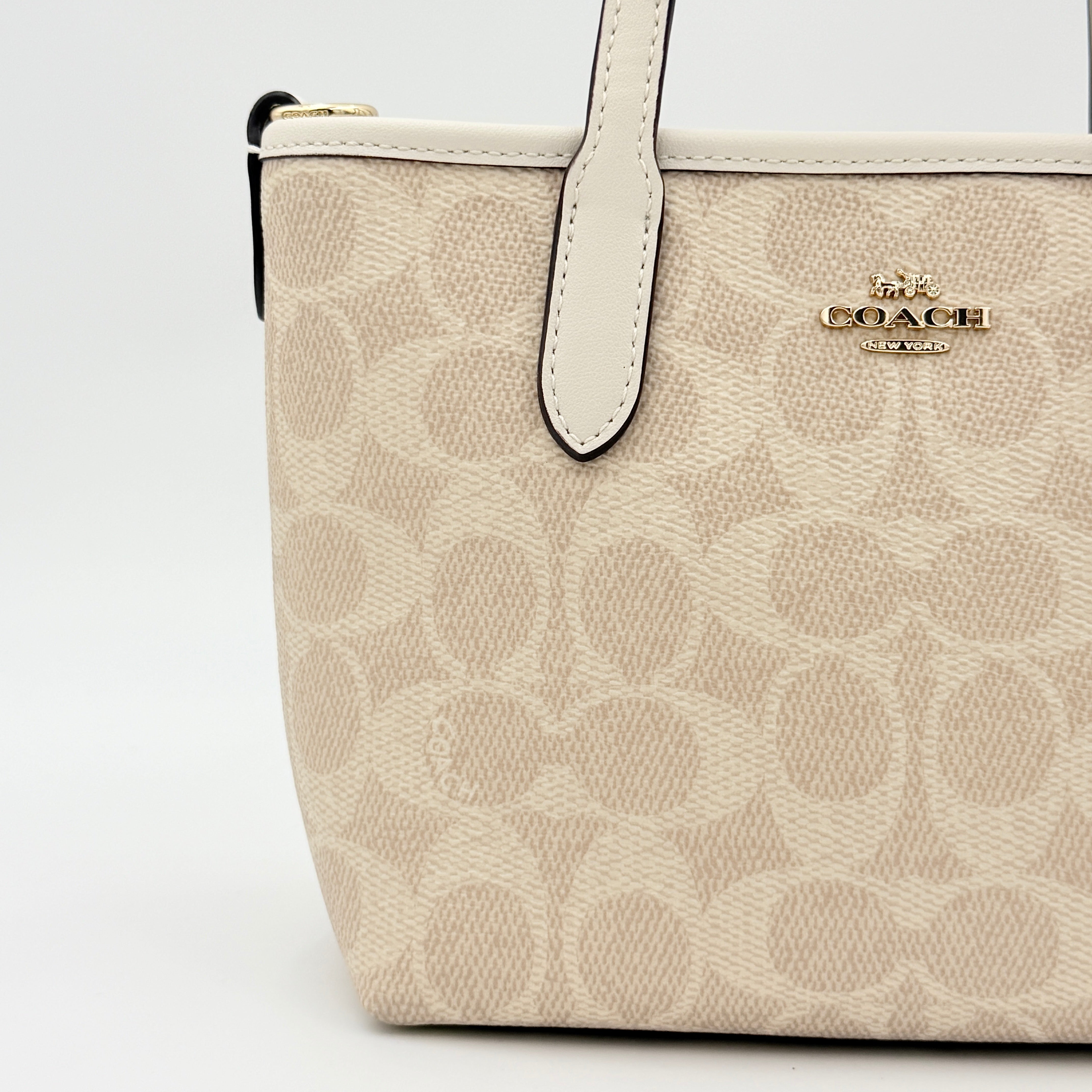 Coach 2Way Mini City Tote in beige and white with signature jacquard, shown with detachable logo canvas strap.
